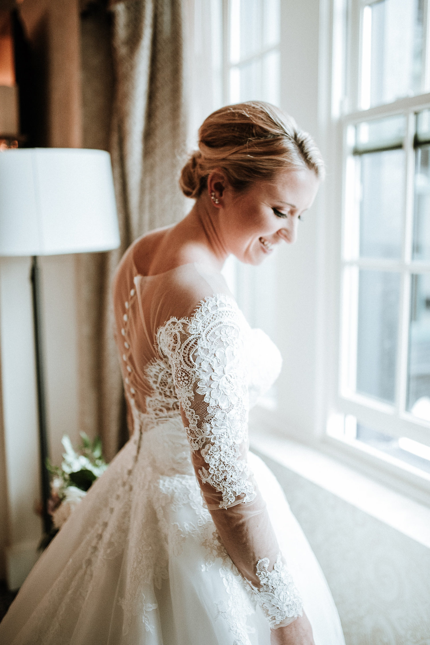 Bride+smiling+at+window.jpeg