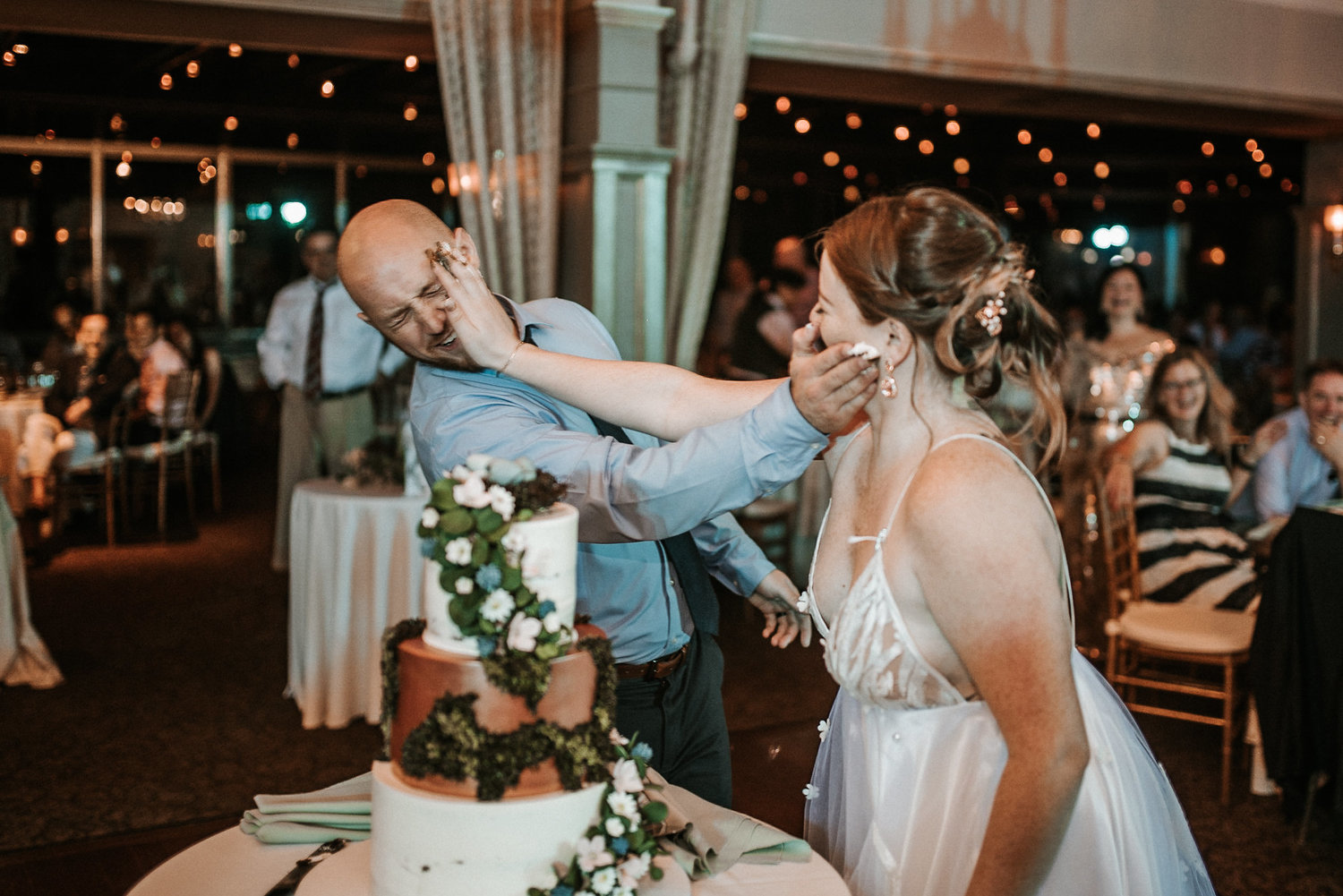 Bride+and+groom+smashing+cake.jpeg