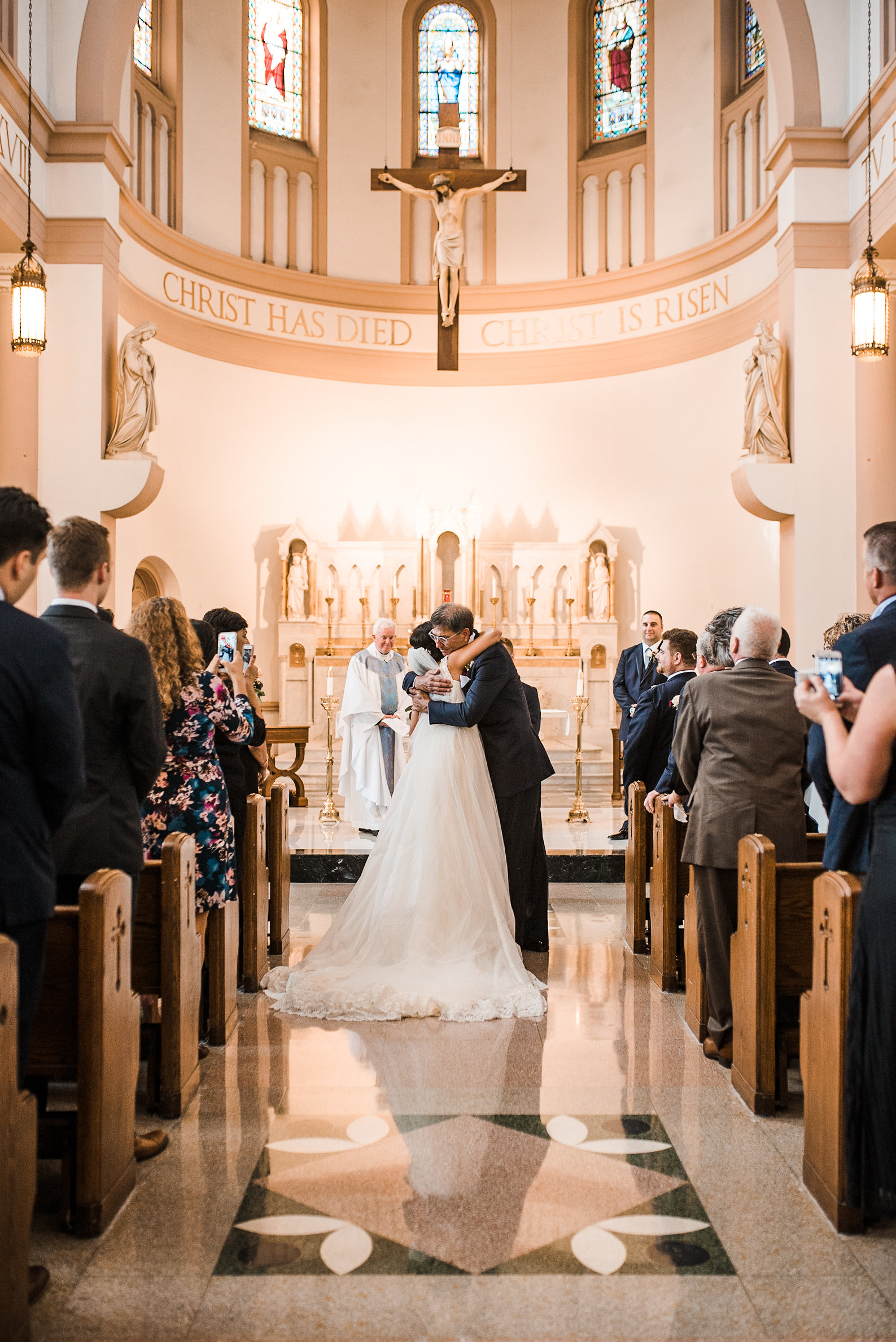 Father+and+bride+hug+at+end+of+aisle.jpeg