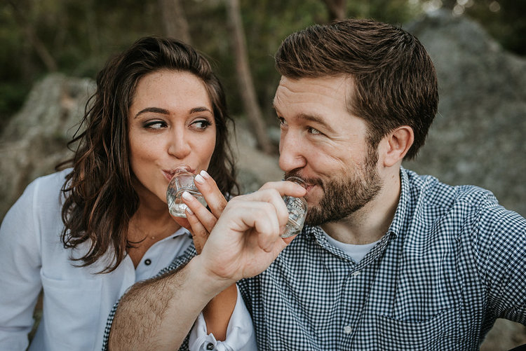 couple+drinking+tequila+during+engagement+session+at+Great+Falls+National+Park.jpeg