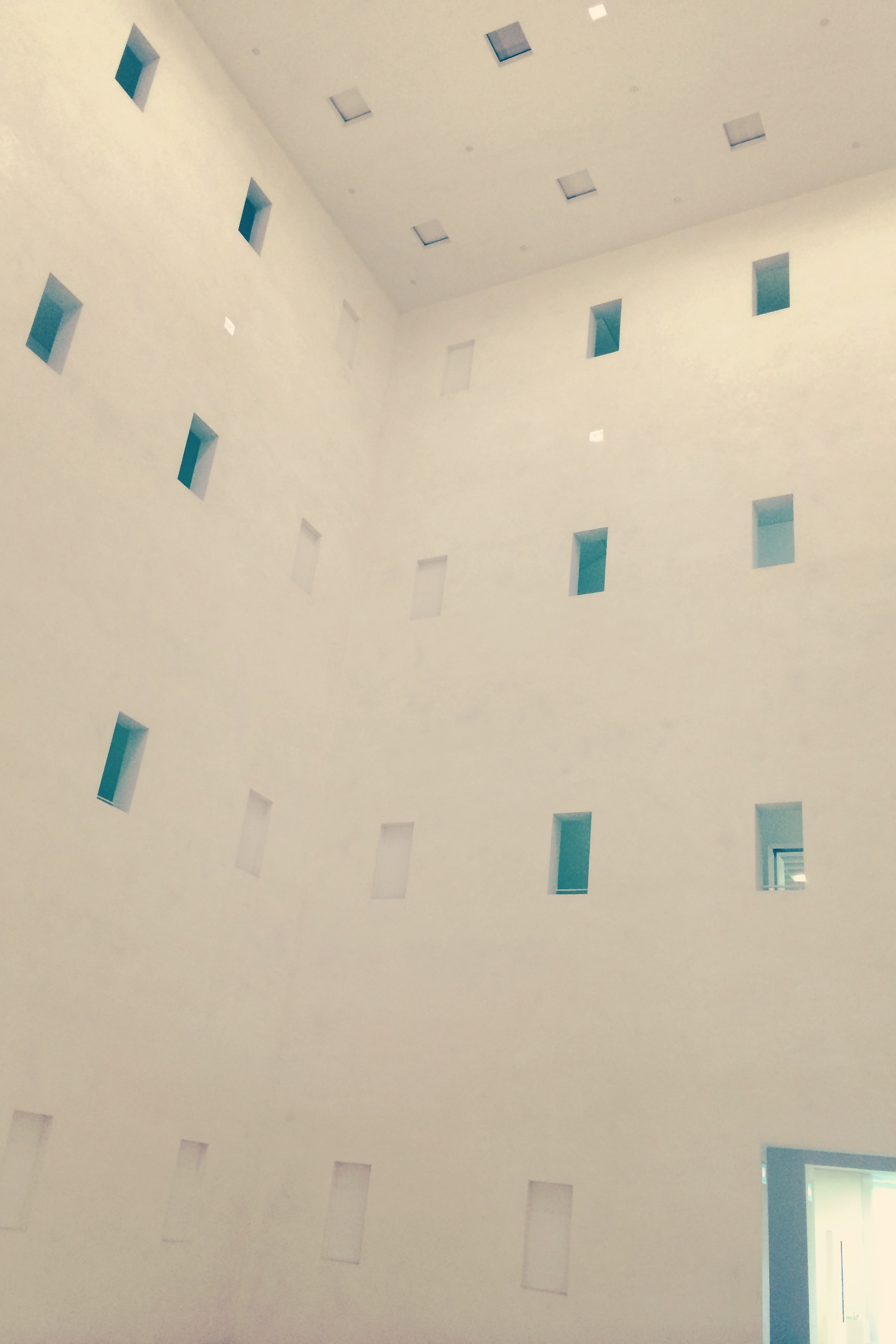 There is a big, empty room with windows in the center of the library building. It has just one tiny fountain in the middle, and maybe an art installation and that's it.
