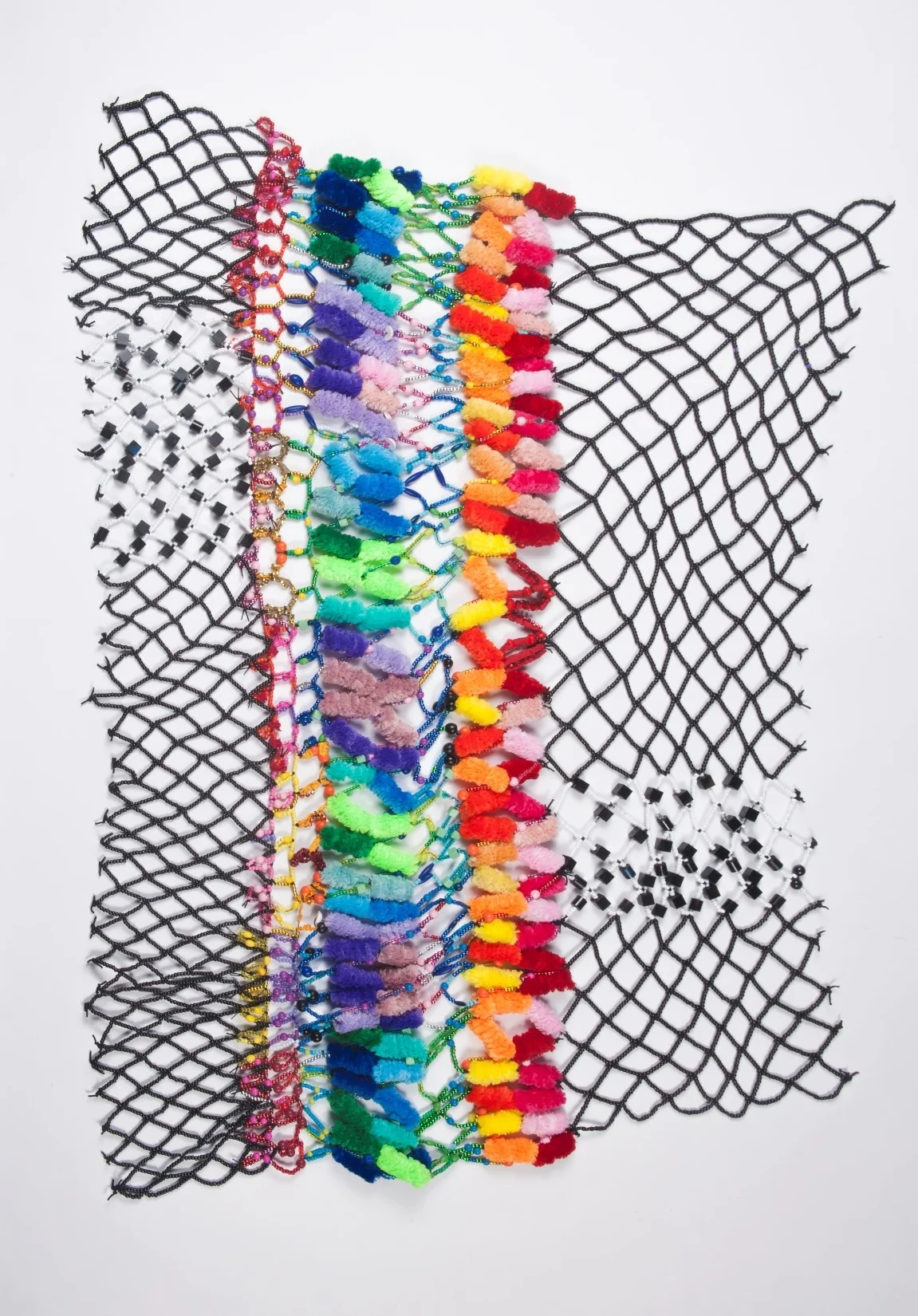 #11 - Fuzzy Warmth Kathryn Usher and Nadine Charity. We all want a warm, safe place to live. Bright fuzzy pipe cleaners and handmade beads make up this blanket.