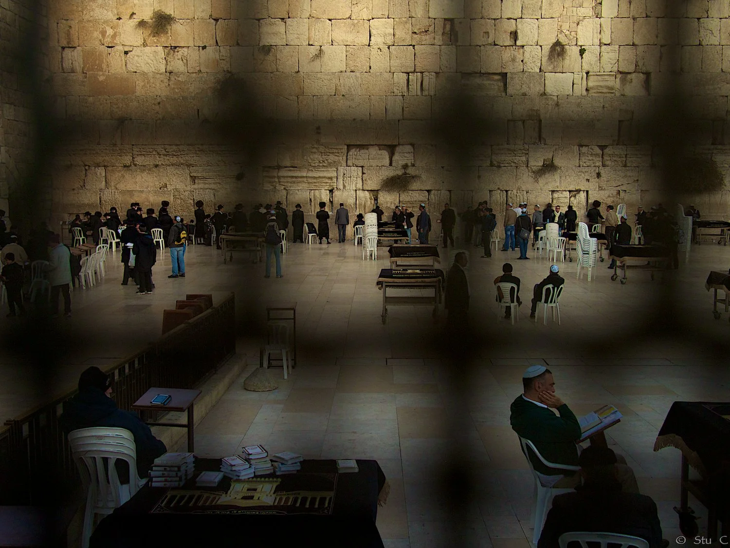 Western Wall seen through security fence providing space for the devout, though entry is not prohibited to others 