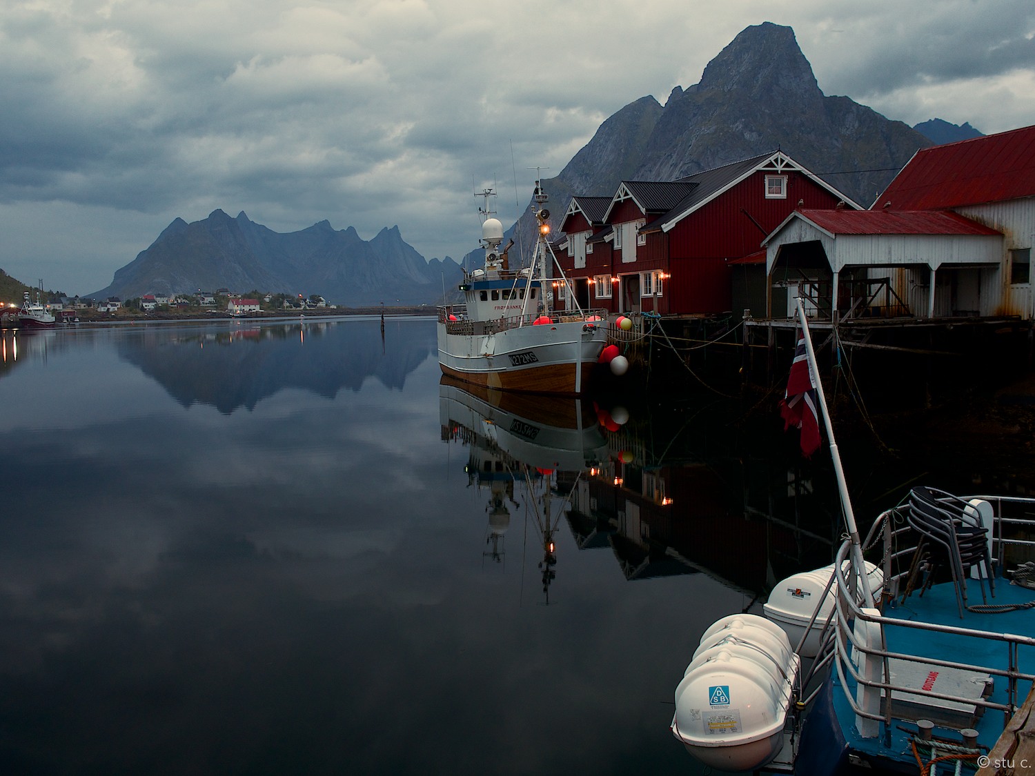 Small as it is, It's very much a working port, with waterways continuing between the distant mountains via fjords Kjerkfjorden and Vorfjorden.