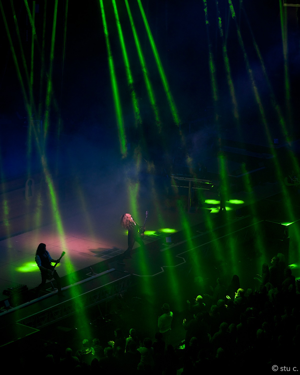 I like how everything works to isolate the blond head of this rocker, even the other one is silhouetted and the audience is partly hidden