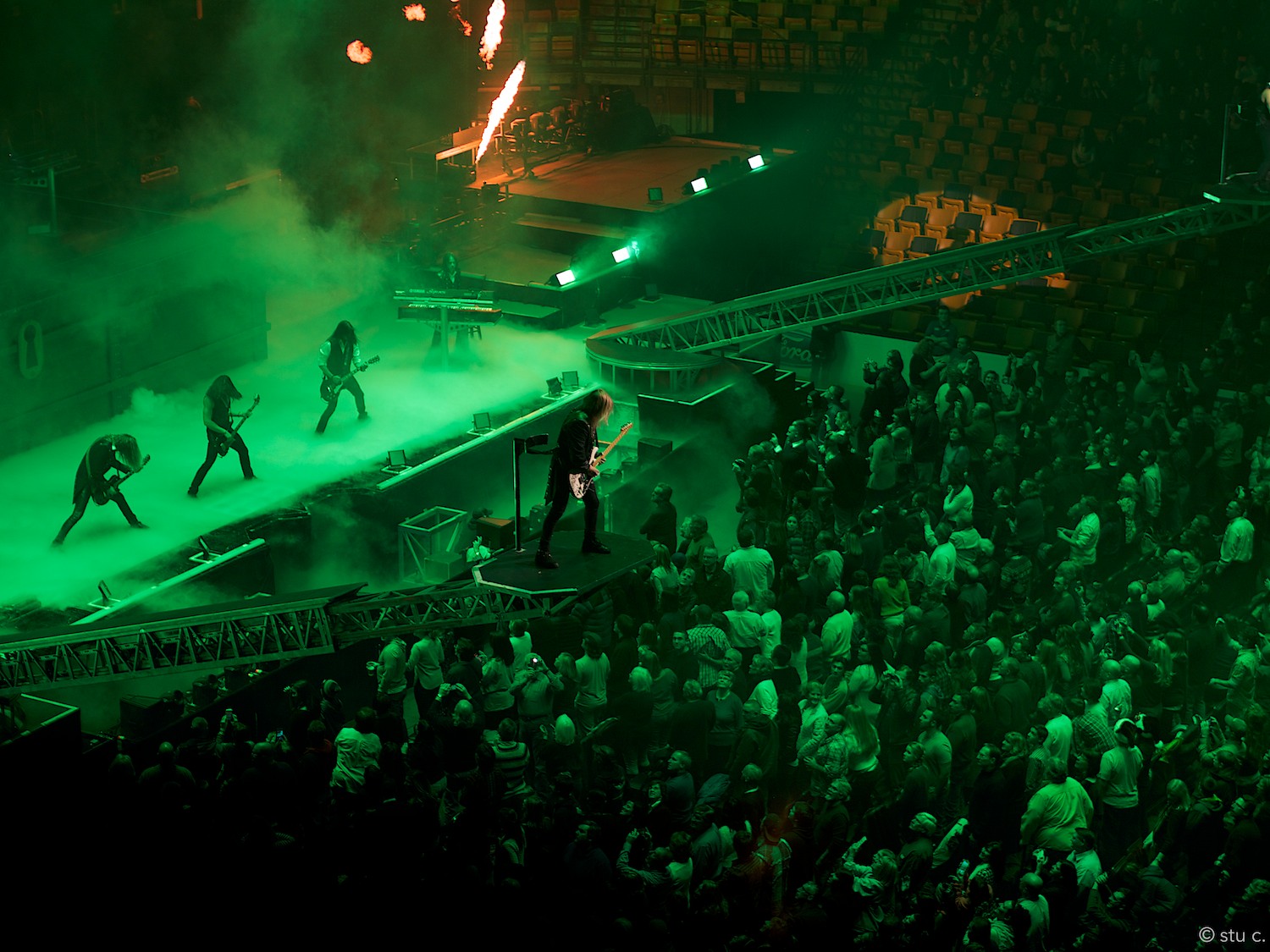Given the interaction between crowd and stage, it's possible to overlook the guy up on the rig