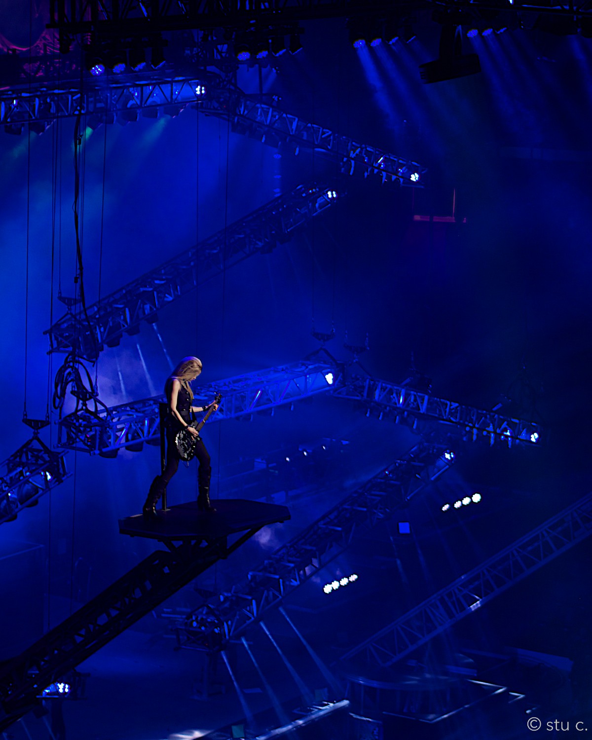 One of the rockers is this woman, who's profiled so dramatically against the lighting rigs