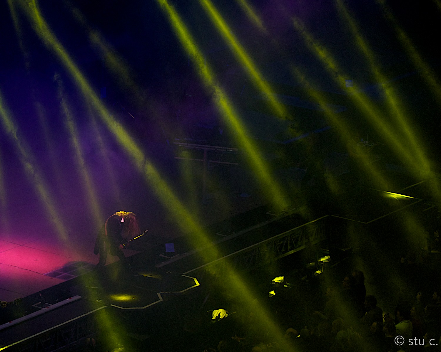 One of my favorite shots; the musician bowing, as if in abeyance to the crowd, upward lights symbolizing their gaze