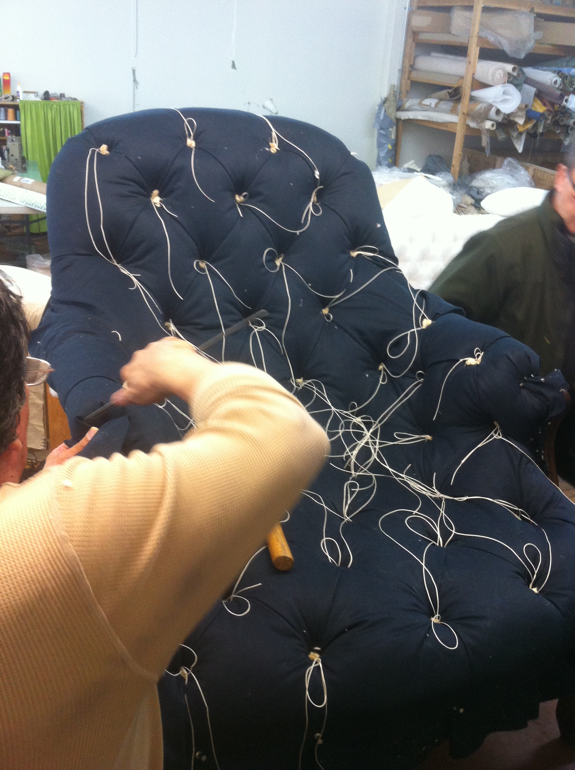 Traditional trim and tufting by hand. 
