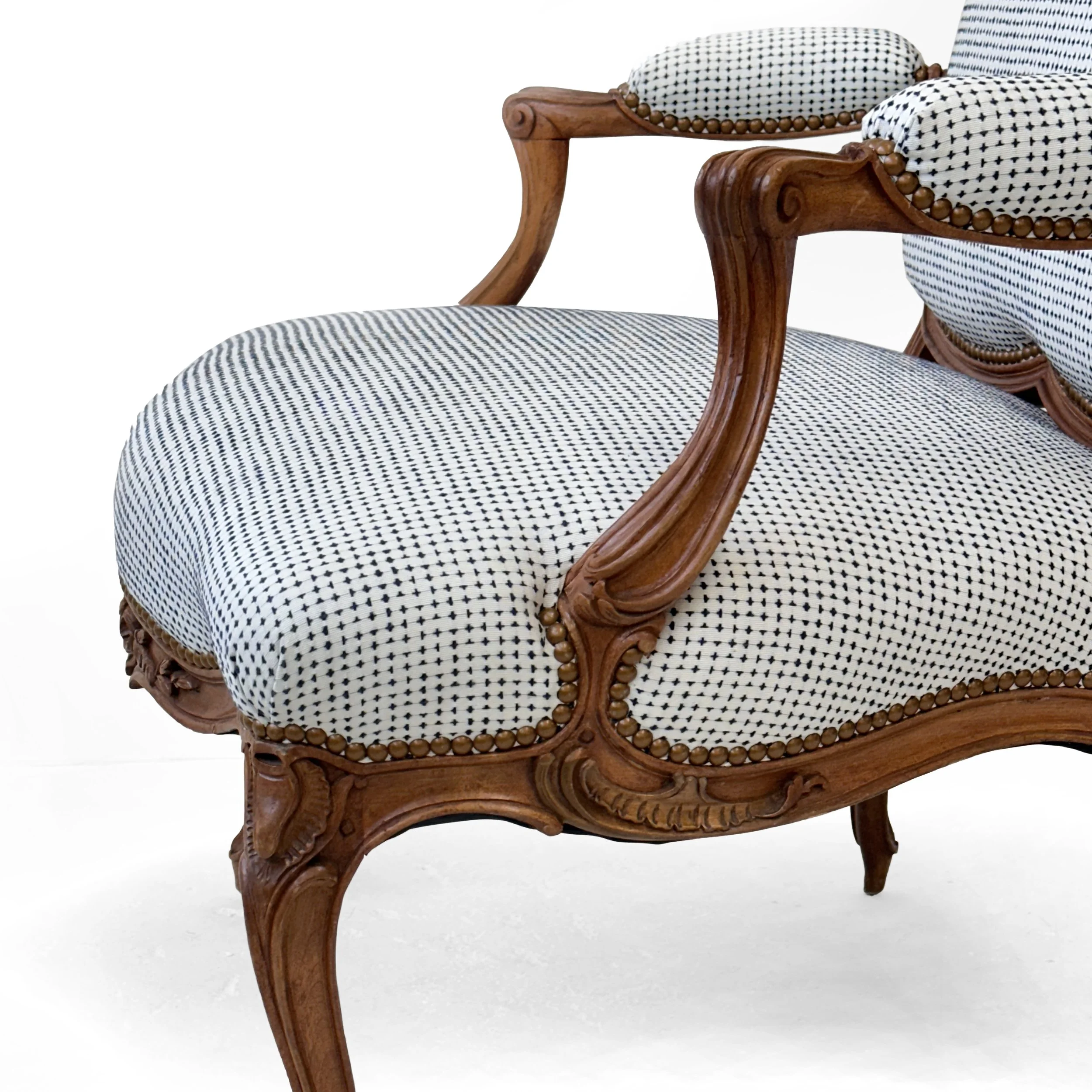 R133-St.-Georges-model-finely-carved-Louis-XV-open-arm-chair-carved-floral-details-and-graceful-curved-silhouettes-Victoria-&-Son-upholstered-Nail-head-trim-scrolls-white-color.jpg