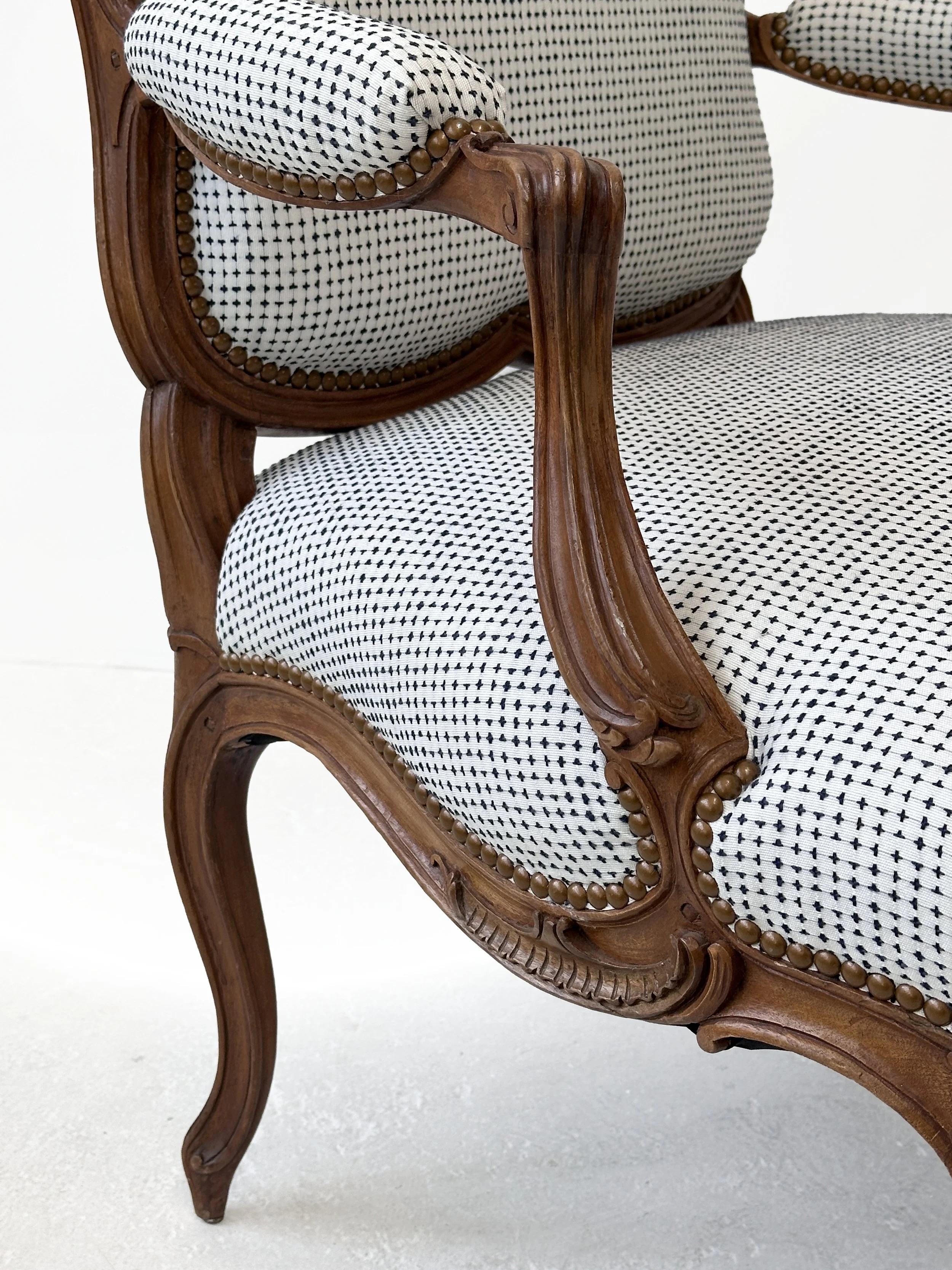 R133-St.-Georges-model-finely-carved-Louis-XV-open-arm-chair-carved-floral-details-and-graceful-curved-silhouettes-Victoria-&-Son.jpg
