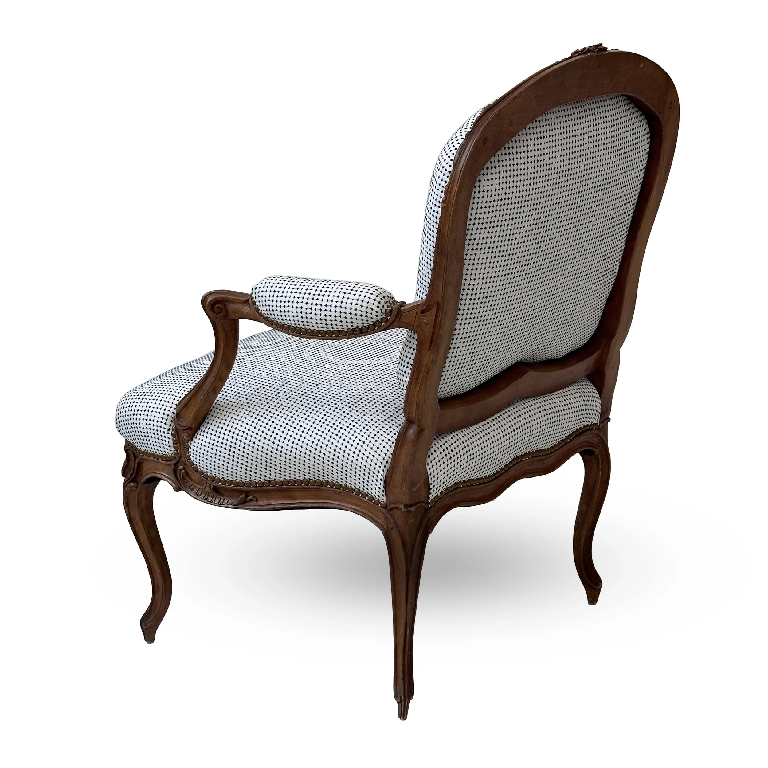 R133-St.-Georges-model-finely-carved-Louis-XV-open-arm-chair-carved-floral-details-and-graceful-curved-silhouettes-Victoria-&-Son-upholstered-Nail-head-trim-scrolls-white.jpg