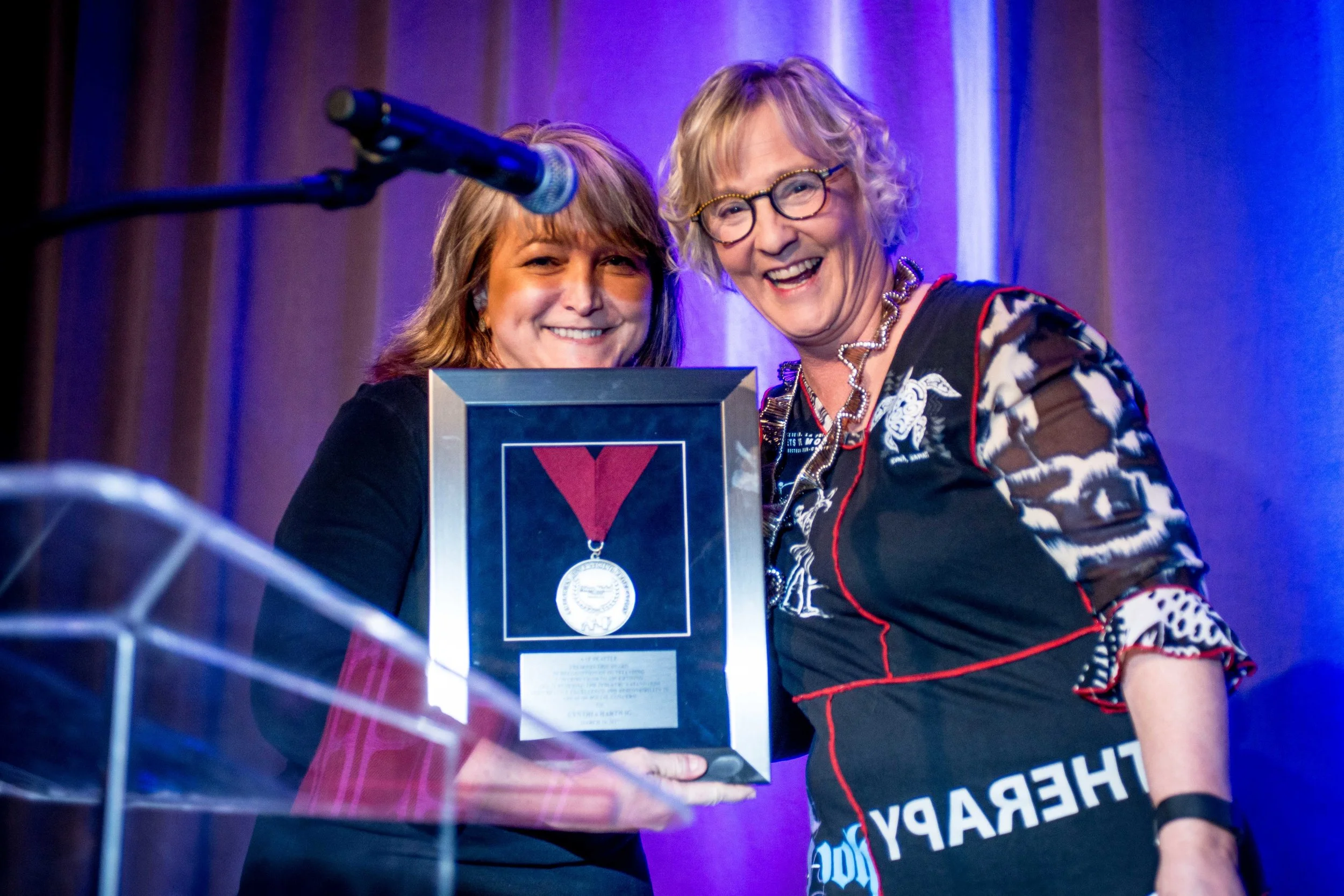 Cynthia Hartwig (R) with the AAF Silver Medal Award, presented to her by Mary Knight (L)