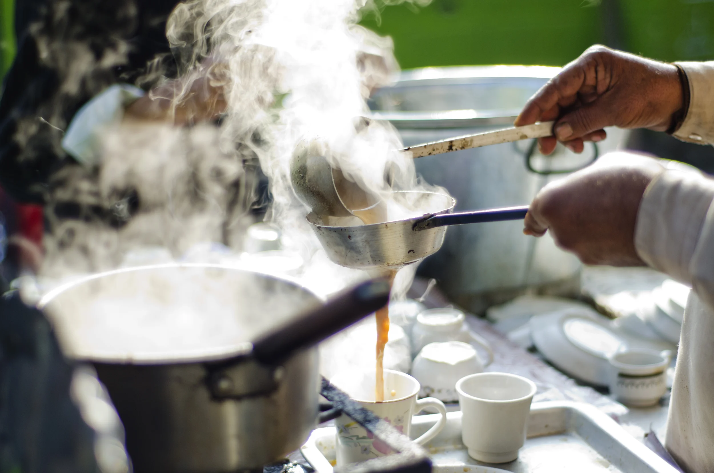 straining hot chai