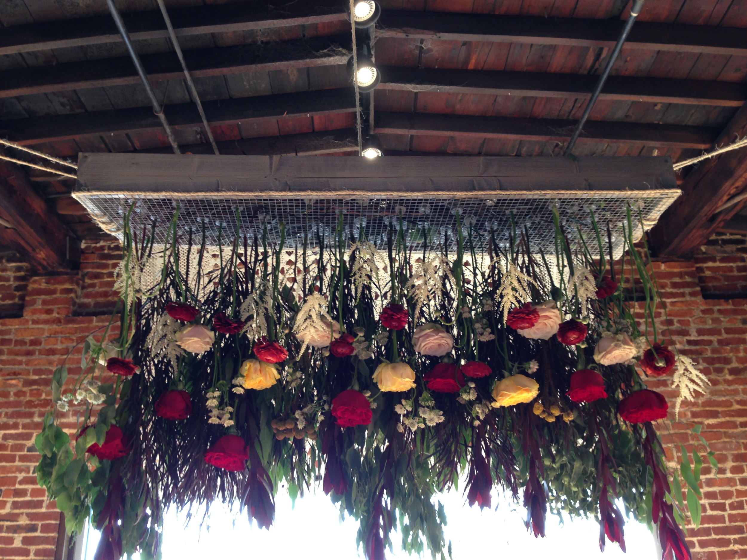 The stunning florals that were hanging over the happy couple as they exchanged vows. By the very talented Mary Love Richardson of Rosemary & Finch.