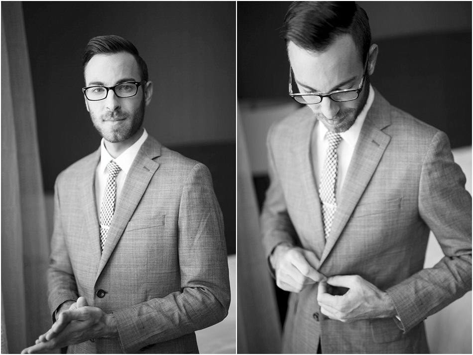 Male photographer in a suit and glasses