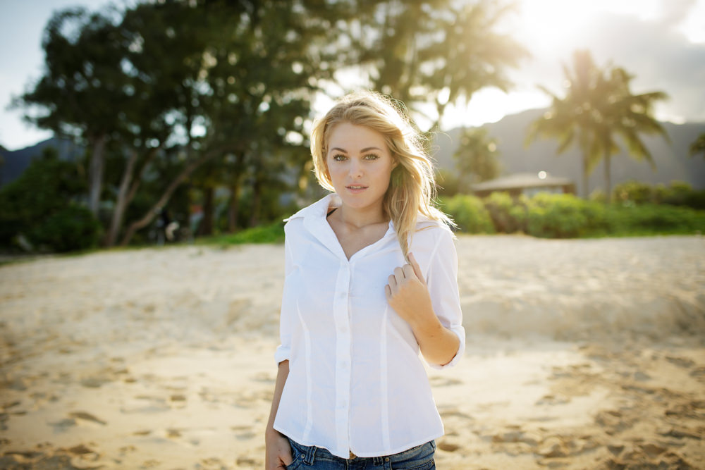 beautiful portrait of woman at sunset at hawaii beach