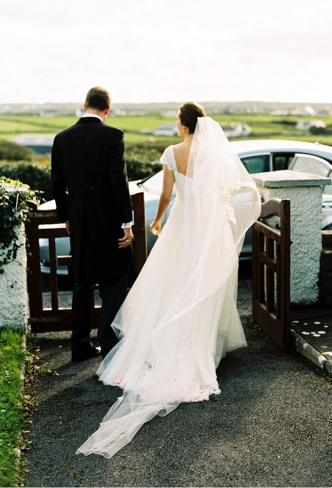 Whitney Toombs in Monique Lhullier.