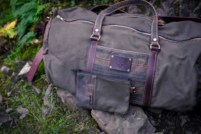 The Private Reserve Duffel features soft leather handles, removable shoulder strap and brass hardware. The waxed canvas was designed to withstand wear and tear and improve with age.