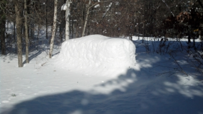 A propane tank-shaped snow pile