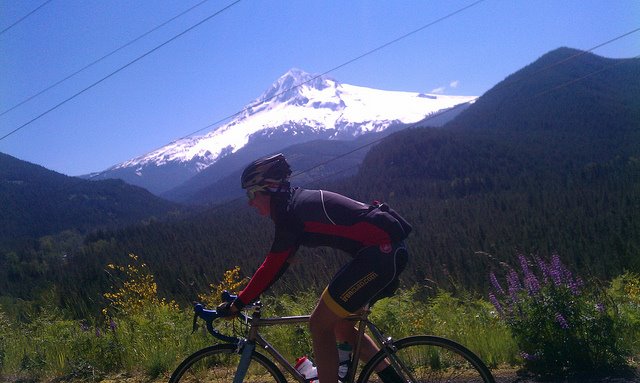 riding over Lolo Pass, Mt Hood in the background, 2011. Photo by Greg Sanders