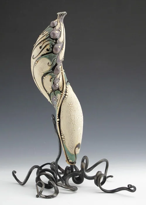 Ceramic by Carol Long , forged steel by Dustin Sypher . 