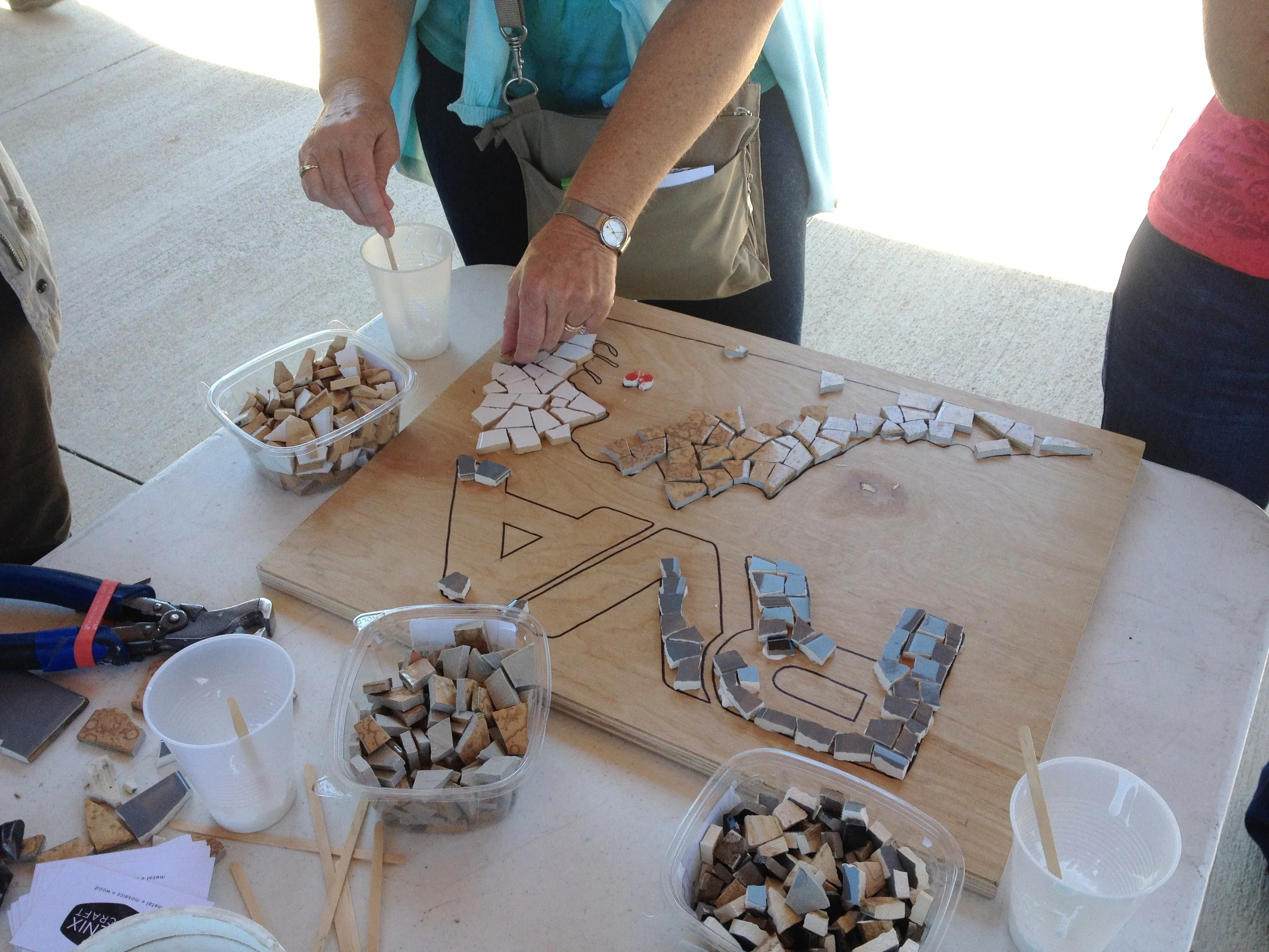 For the mosaic demonstration, we invited the crowd to help us out with a group project featuring the Richmond "RVA" symbol and an outline of Virginia. We created this piece from 100% reclaimed material!