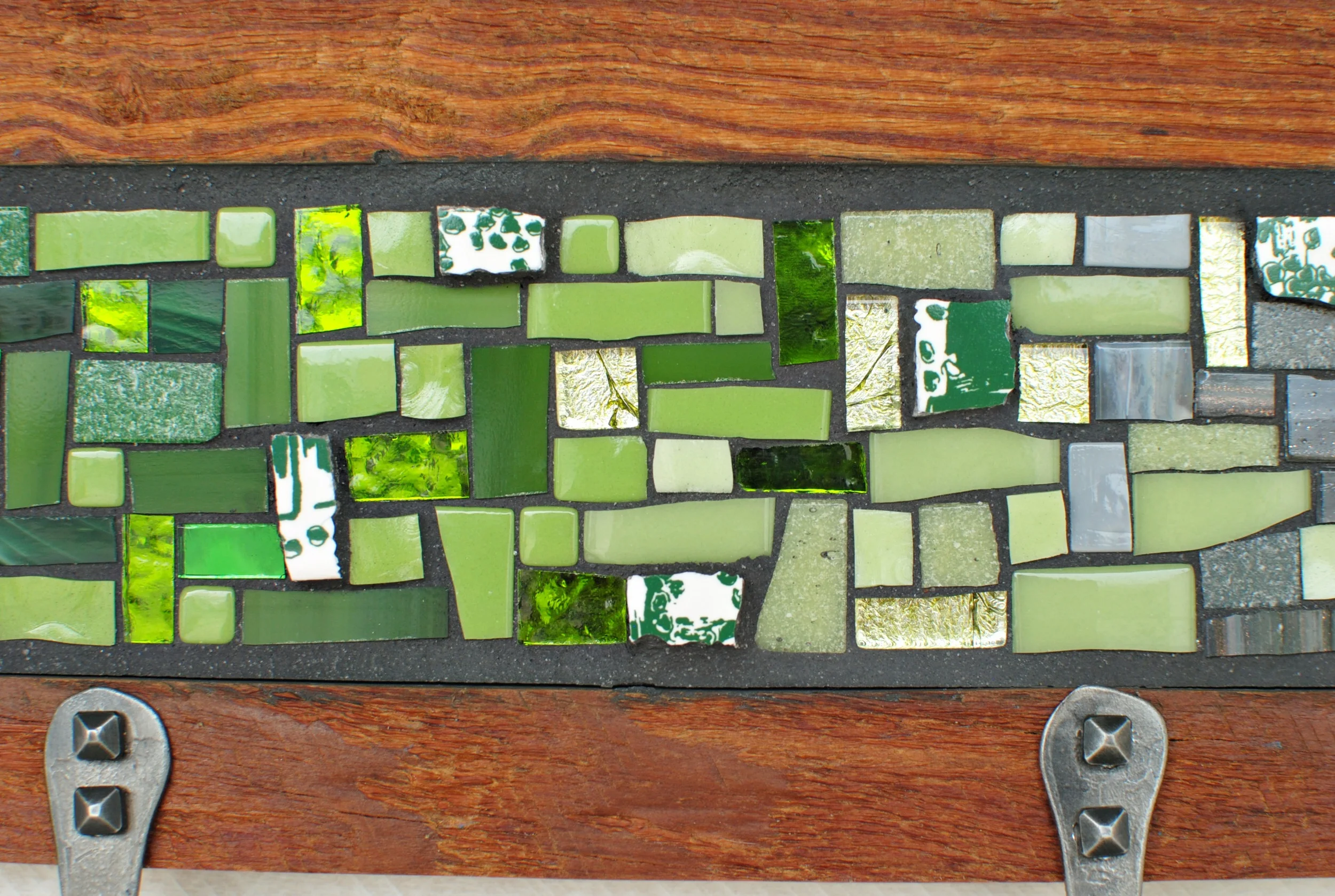 Detail of green and white custom mosaic coat rack