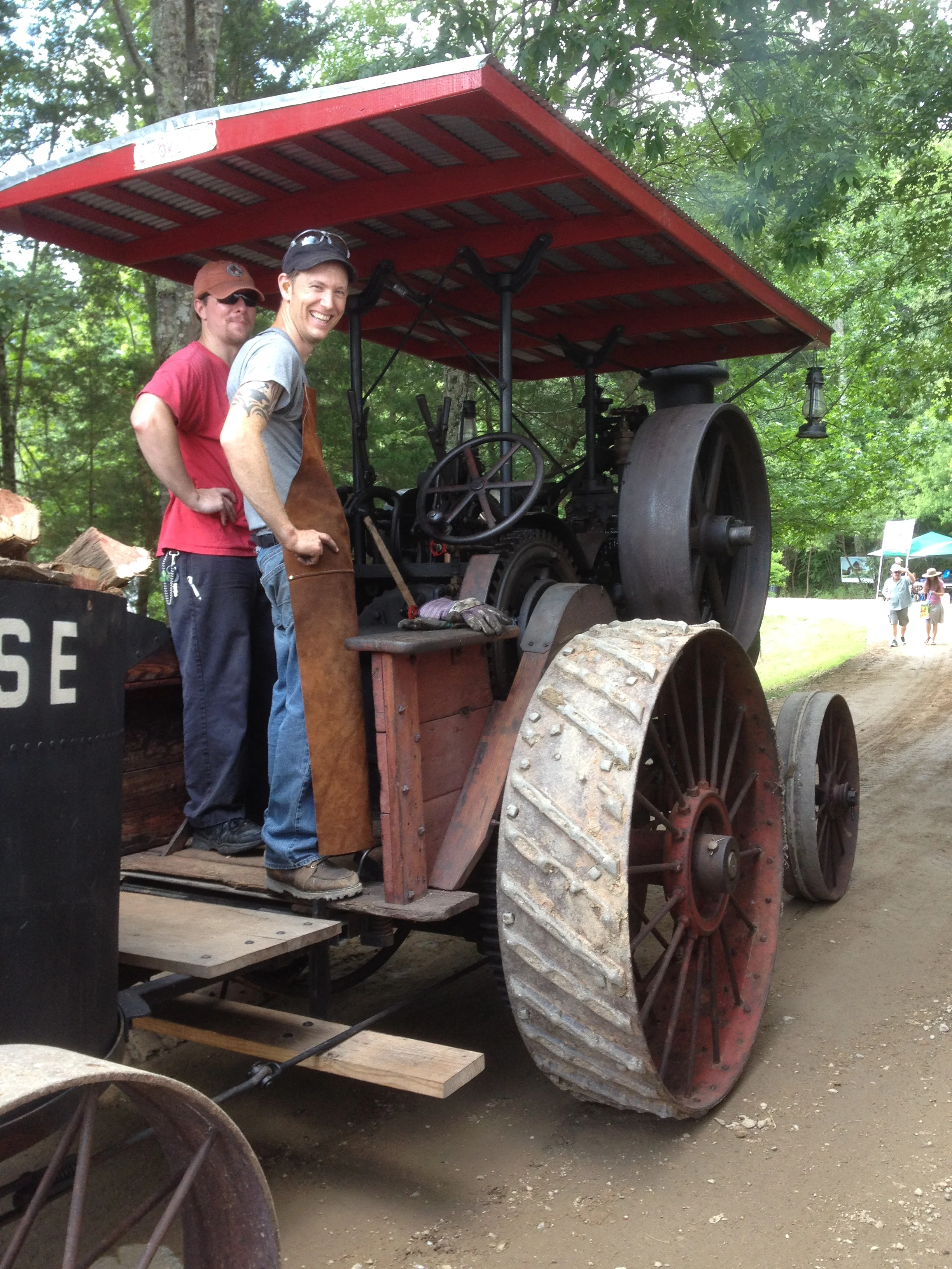 As soon as the tractor pulled to a stop in front of our booth, Kyle hopped on board.