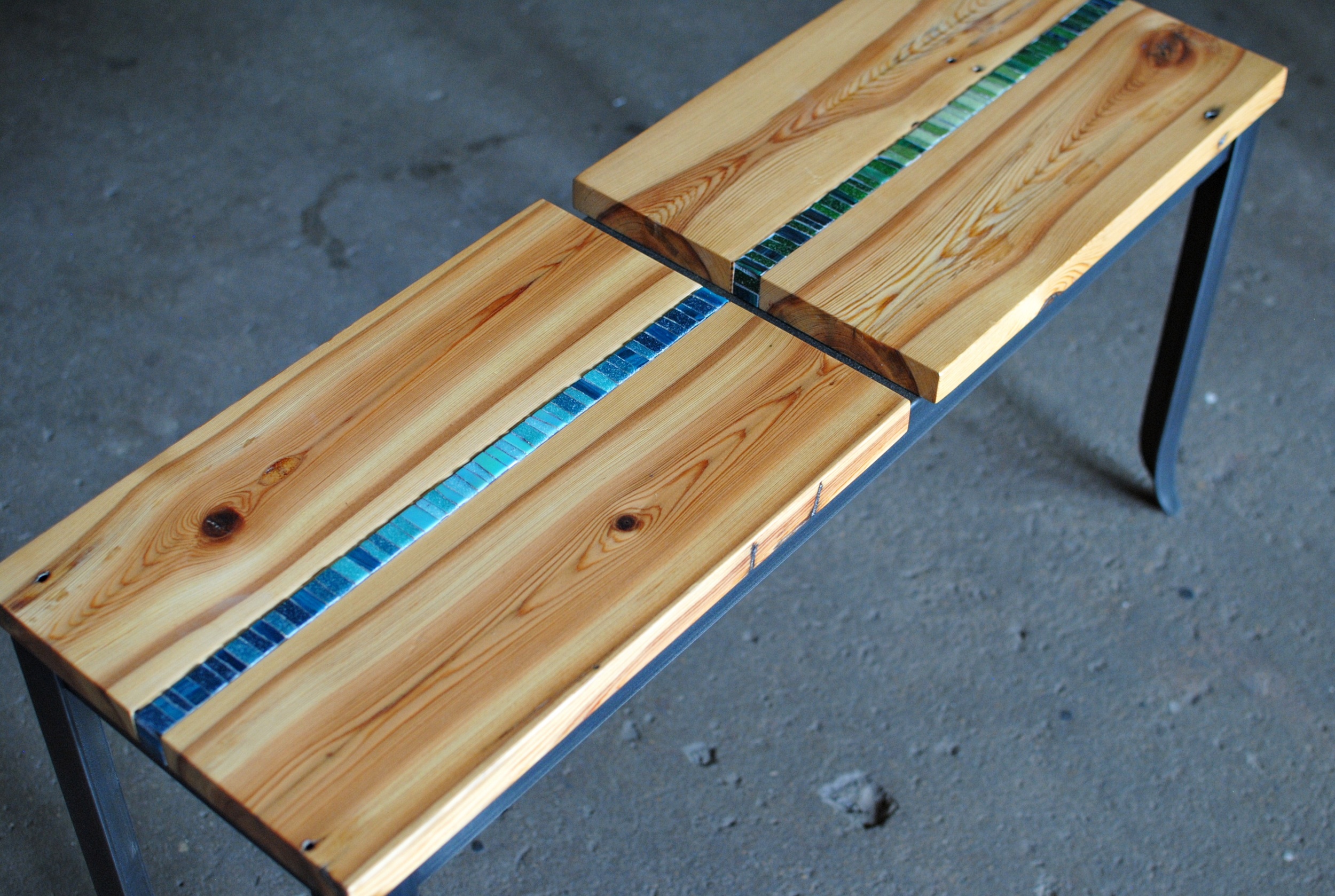 Custom Mosaic Bench with reclaimed heart pine seat with mosaic inlay and forged steel legs