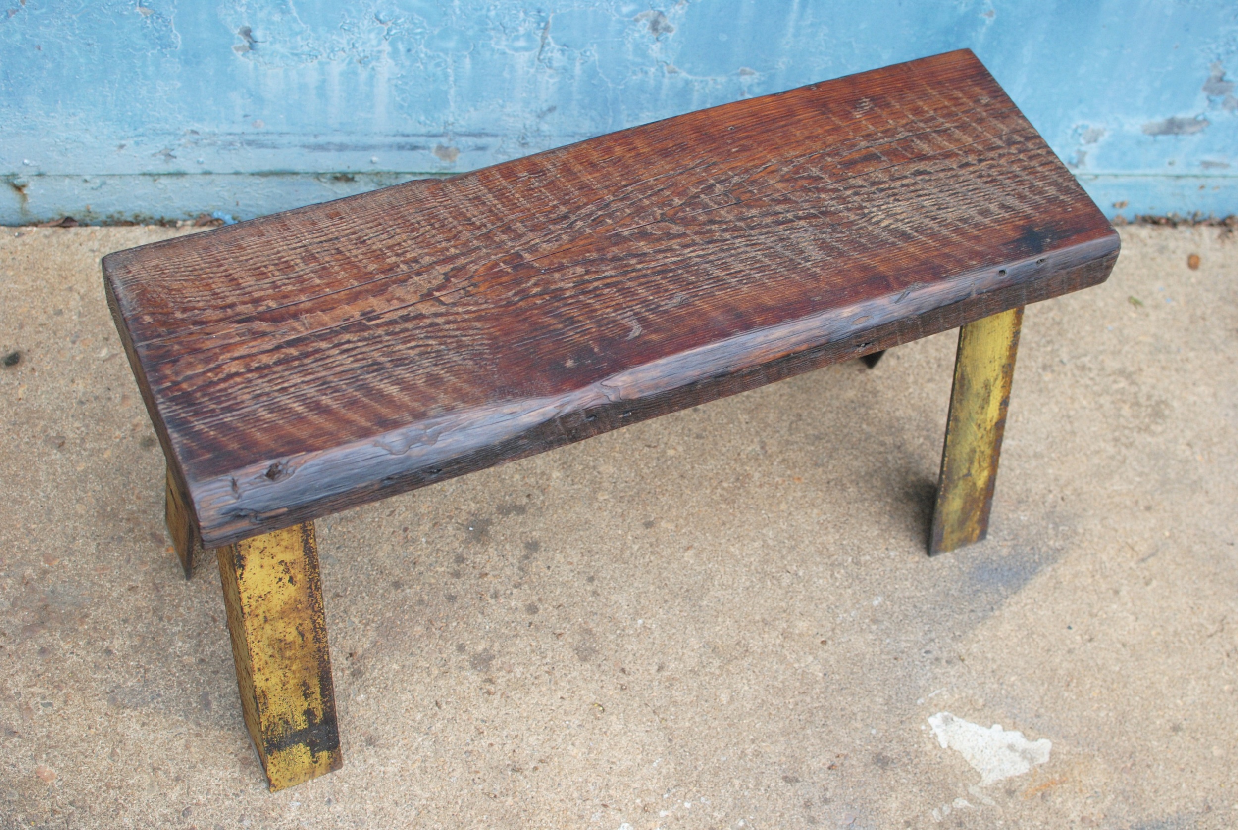 Custom bench with reclaimed wood seat and industrial metal legs