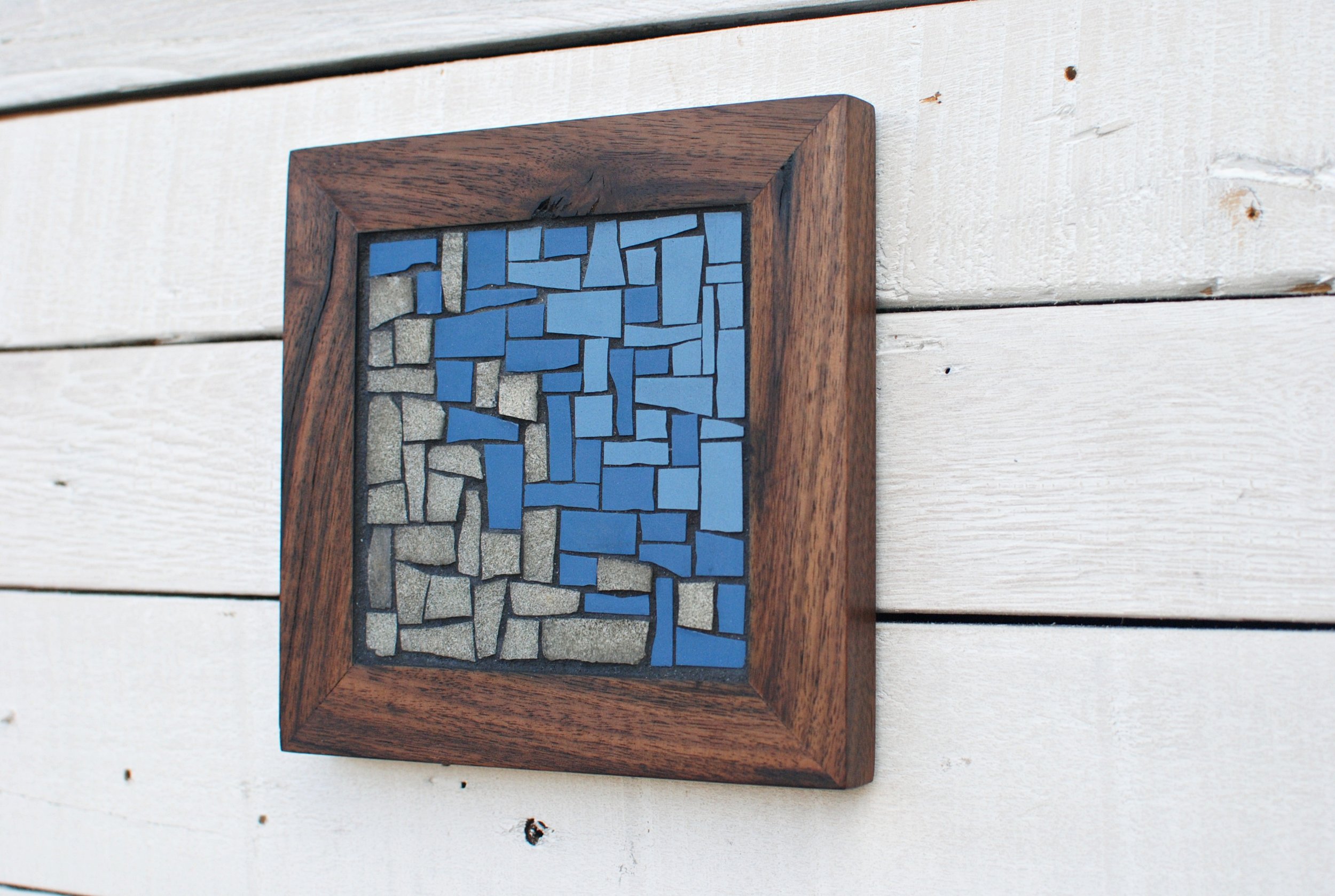 Ocean mosaic trivet on wall