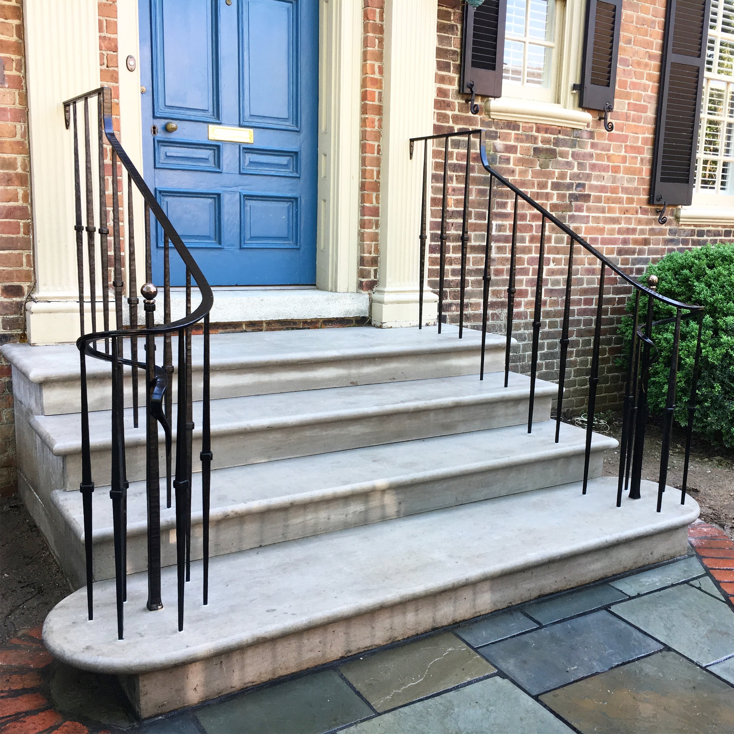 Custom exterior entryway stair railing