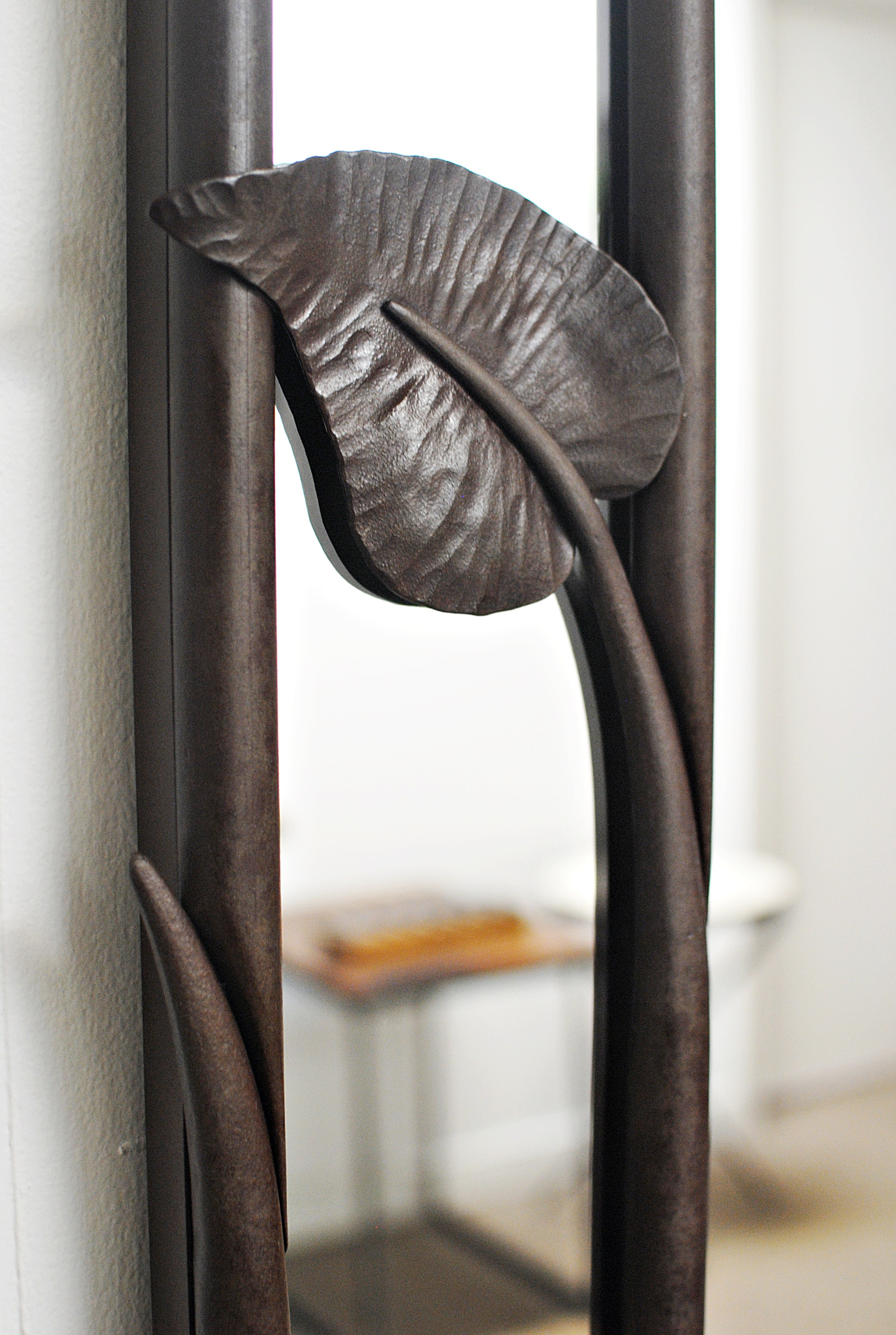 Custom forged mirror leaf detail