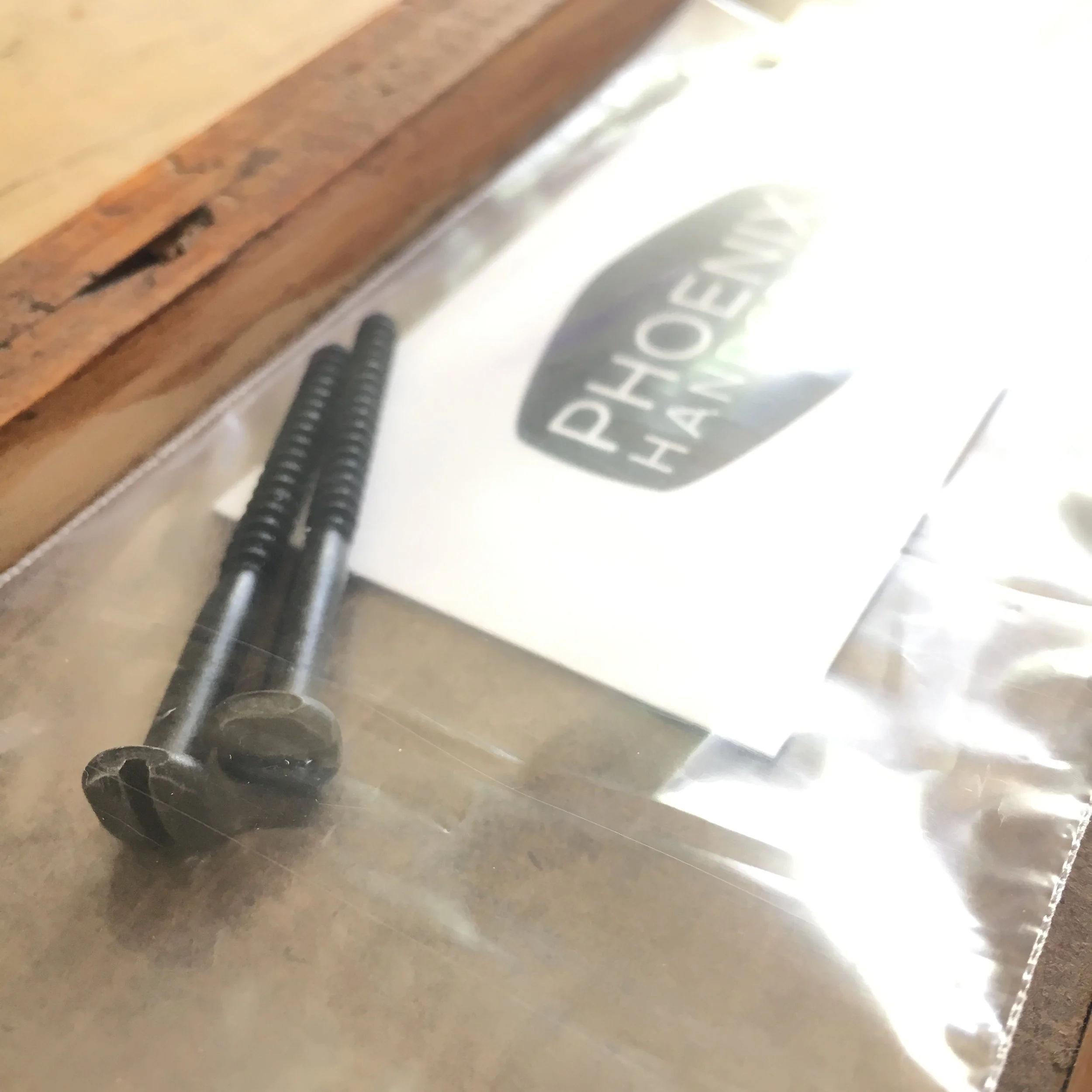 Decorative hardware supplied to install a Phoenix Handcraft mosaic coat rack