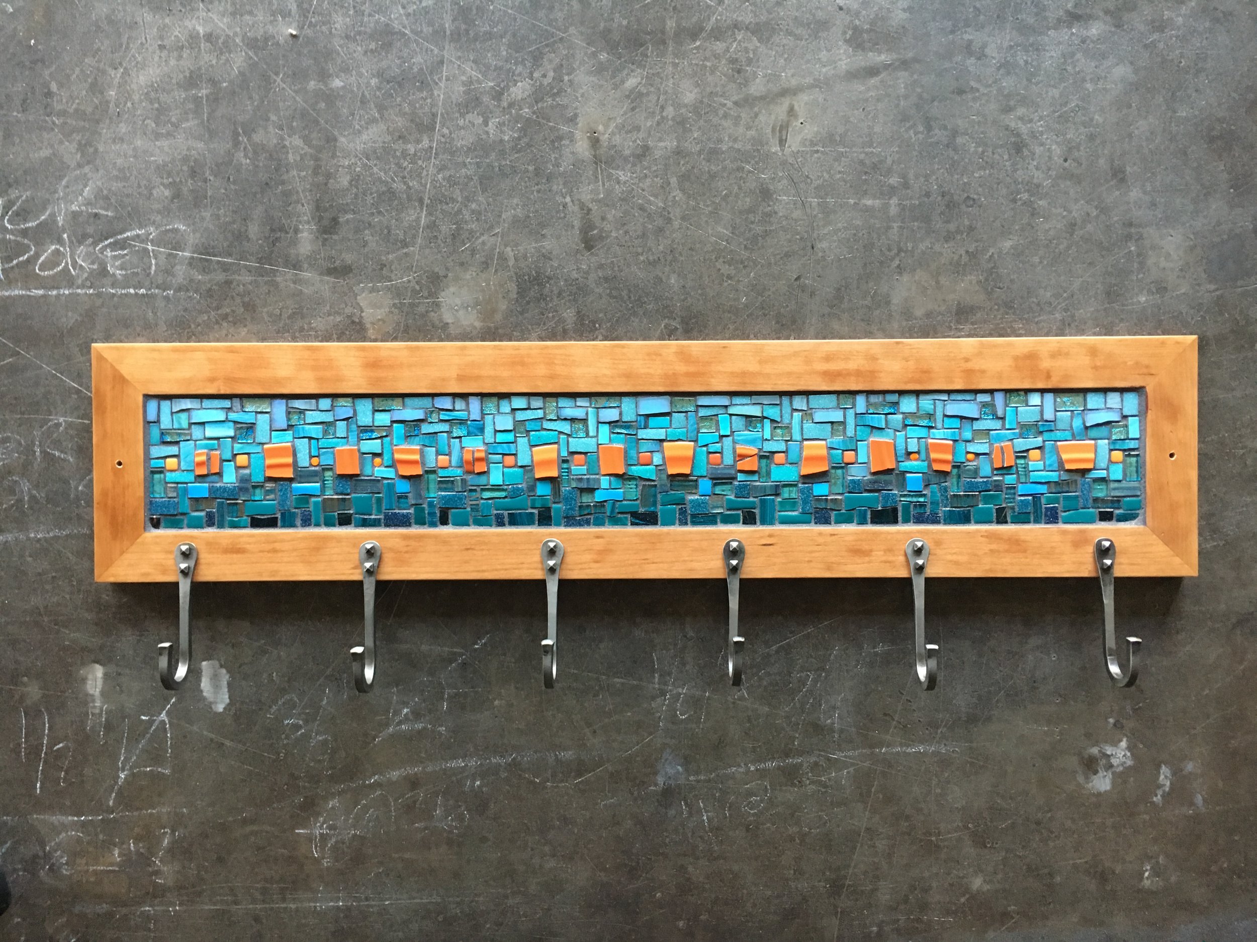 Custom mosaic coat rack in cherry frame with forged steel hooks