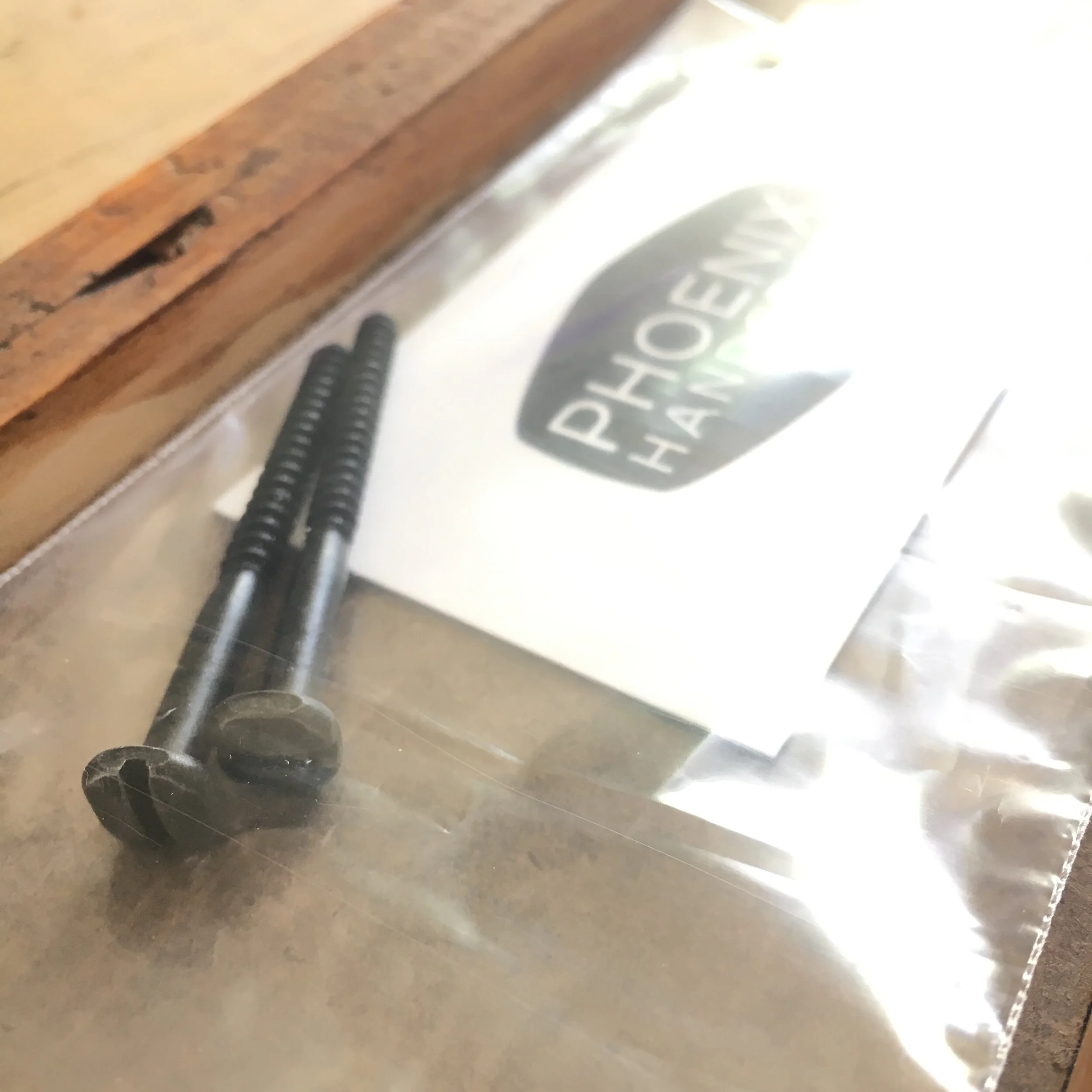 Decorative hardware supplied to install a Phoenix Handcraft mosaic coat rack