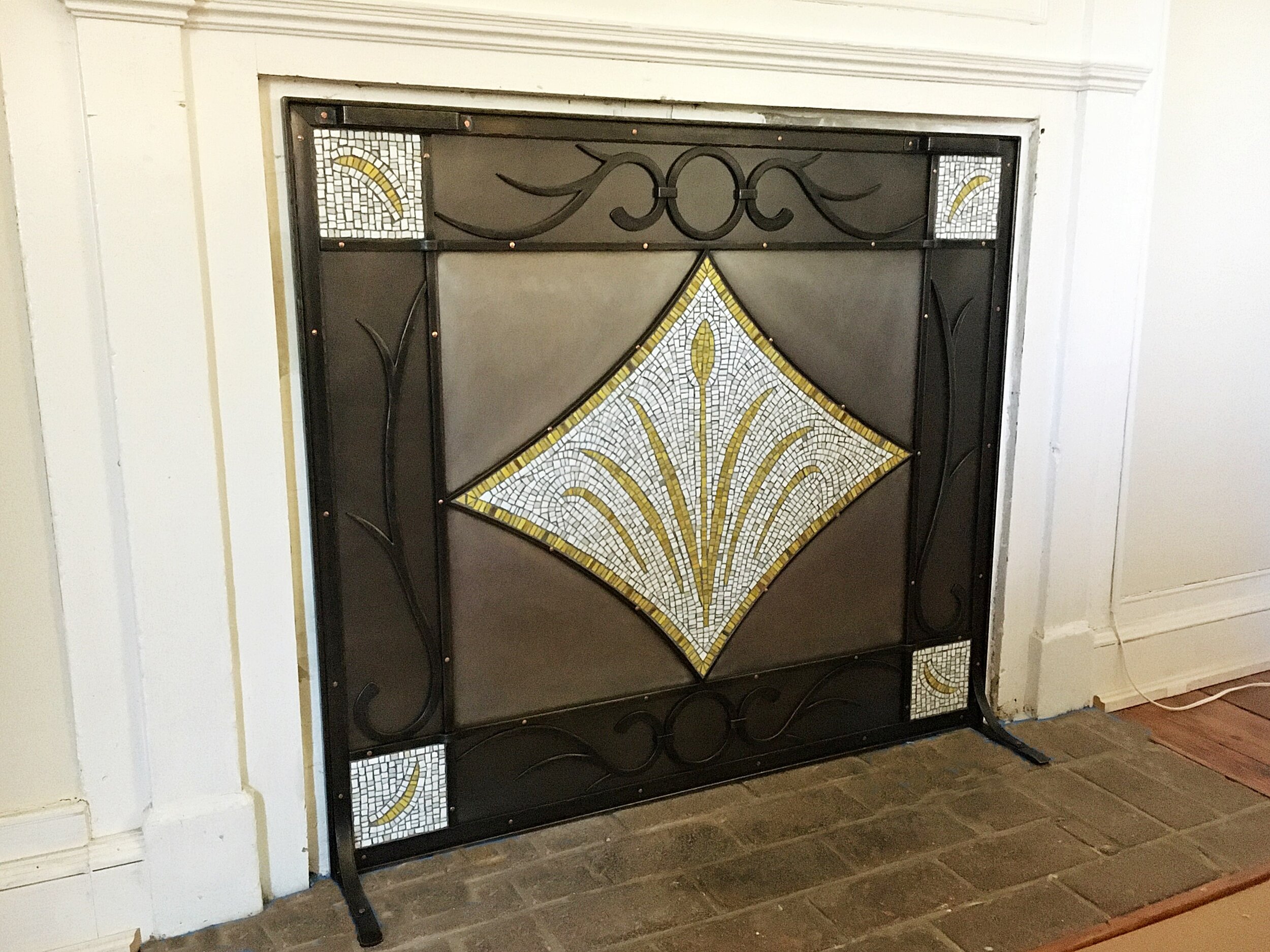 Custom mosaic and metal fireplace cover