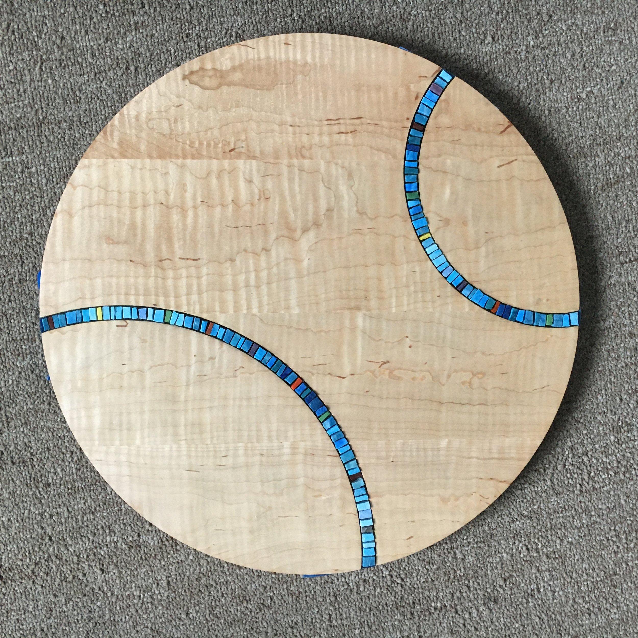 Blue mosaic inlay in maple table top