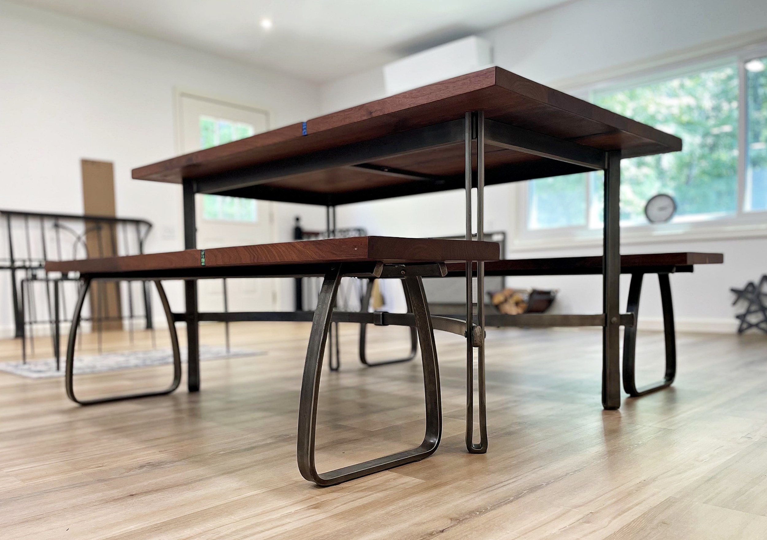 Custom dining table and benches with forged steel bases
