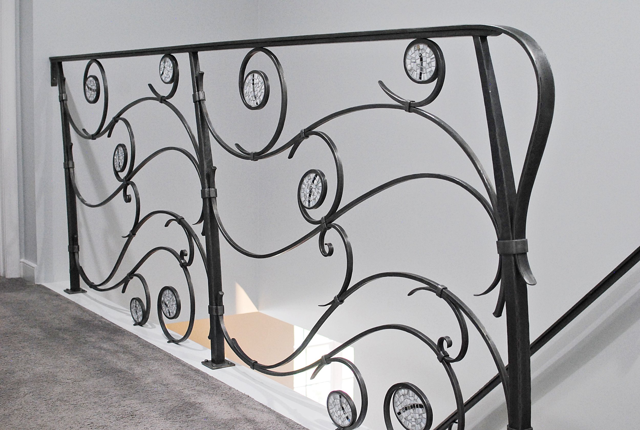 Forged balcony railing with mosaic inserts