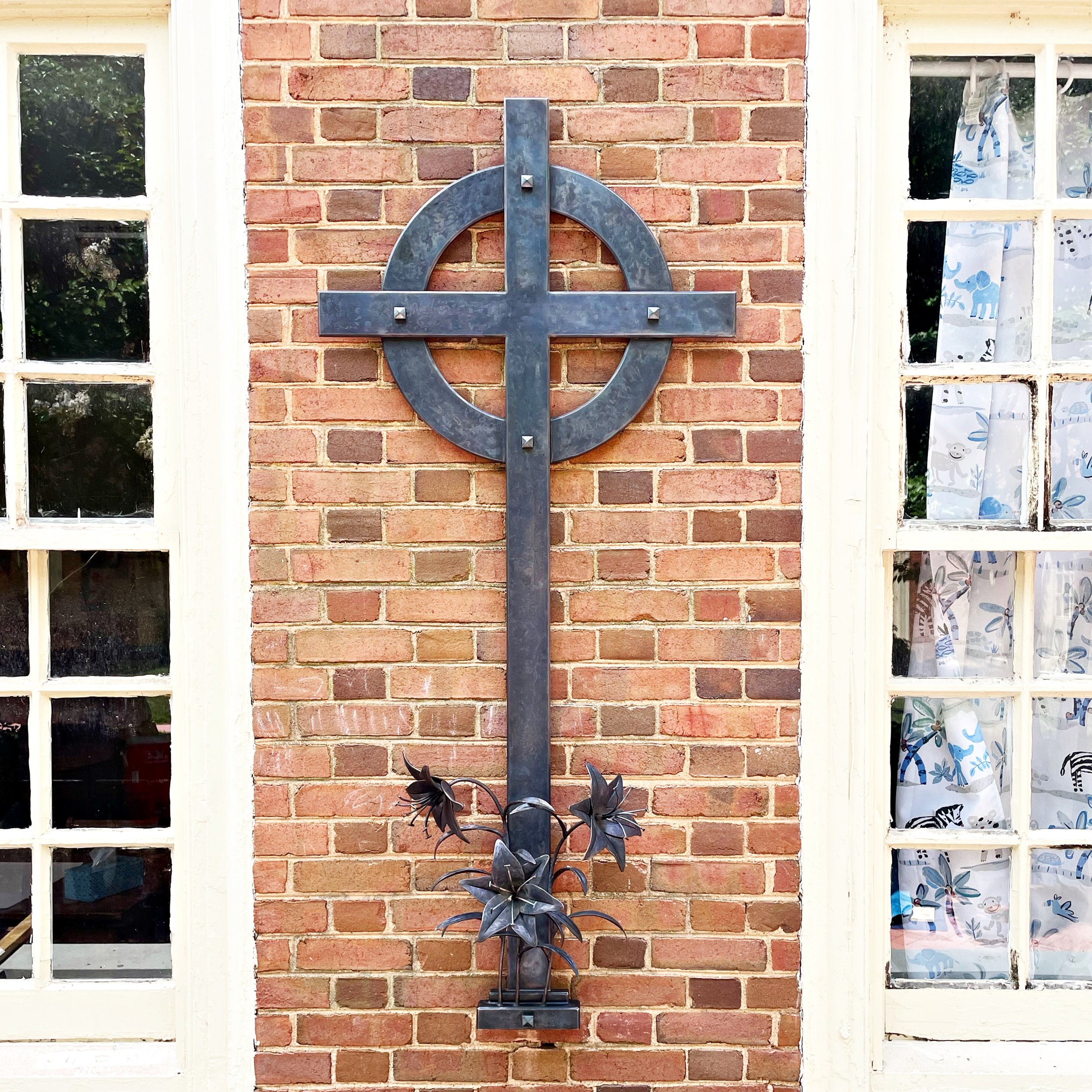 Bronze cross with forged bronze lilies