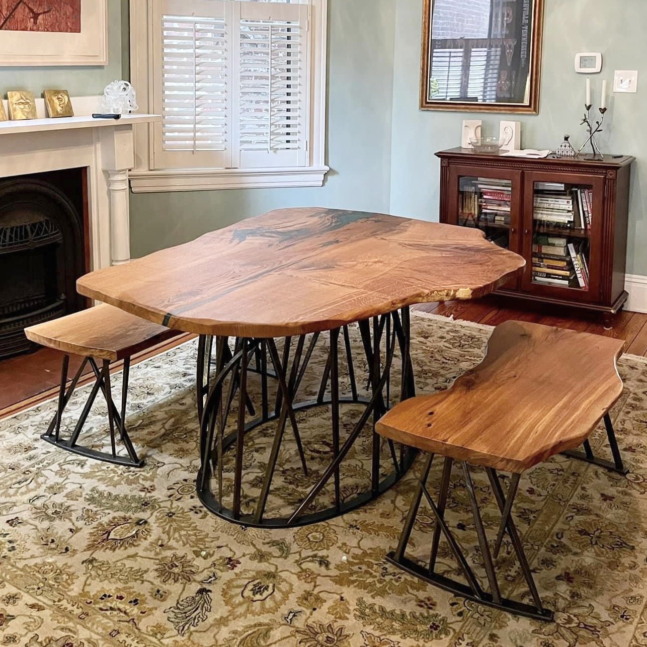 Dining table by Sallie Plumley Studio (walnut tops) and Phoenix Handcraft (forged steel bases)