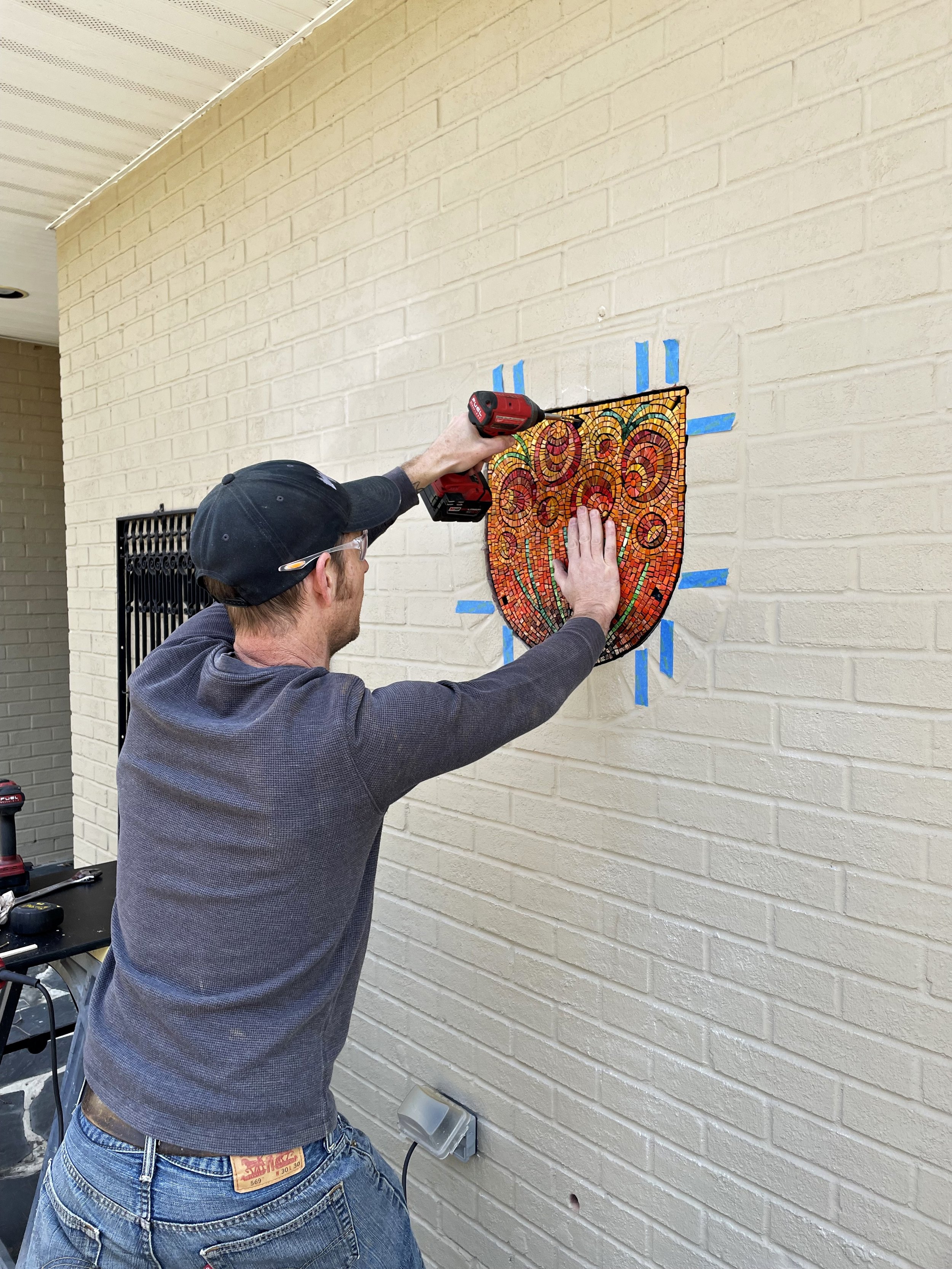 Installing the floral garden mosaic