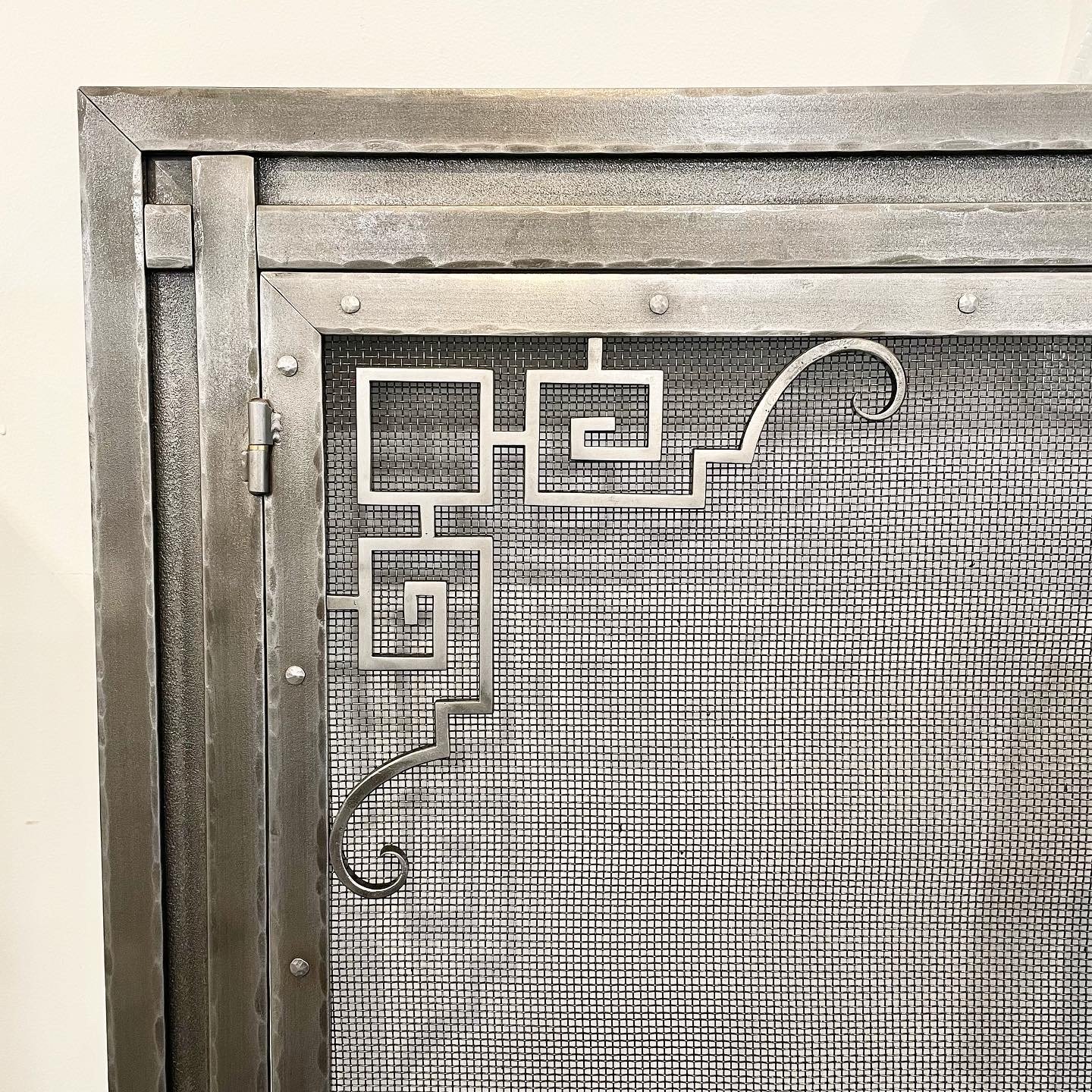 Interior Greek key fireplace screen corner detail