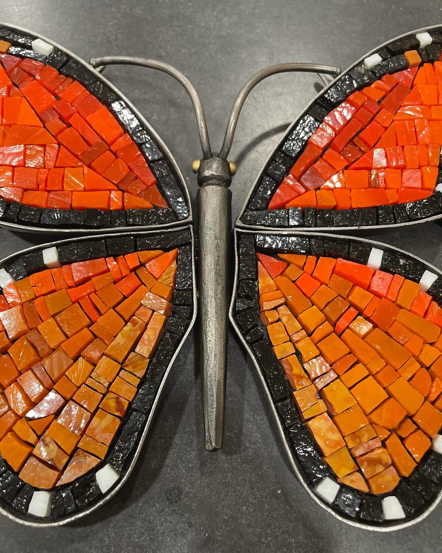 Our latest forged steel + mosaic wall sculpture collaboration. 🦋💫

Swipe through to see the whole process as it starts on Kyle&rsquo;s work table and moves over to Johannah&rsquo;s desk. ⚒️