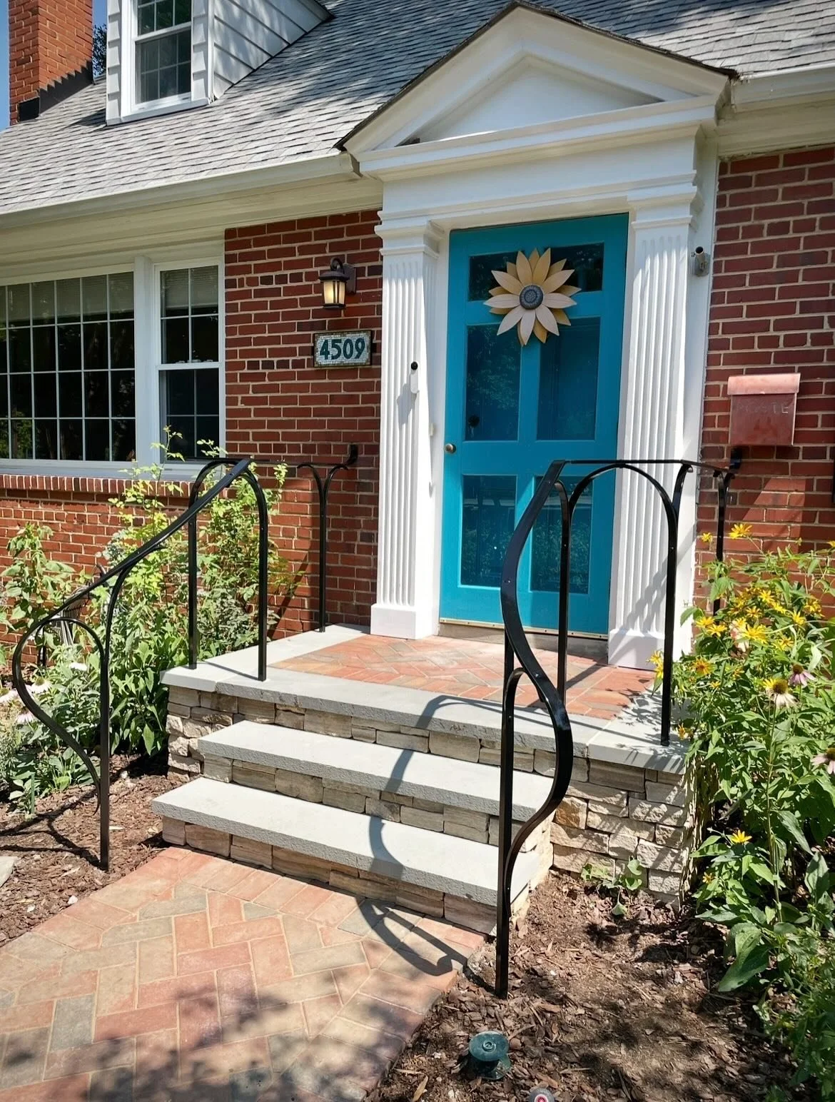 We don&rsquo;t always get to photograph our custom hand-forged railing against such a beautiful garden backdrop. 🌼

We also created a custom mosaic address for this home, inspired because by the colors of the front door. And our &ldquo;Autumn Gingko