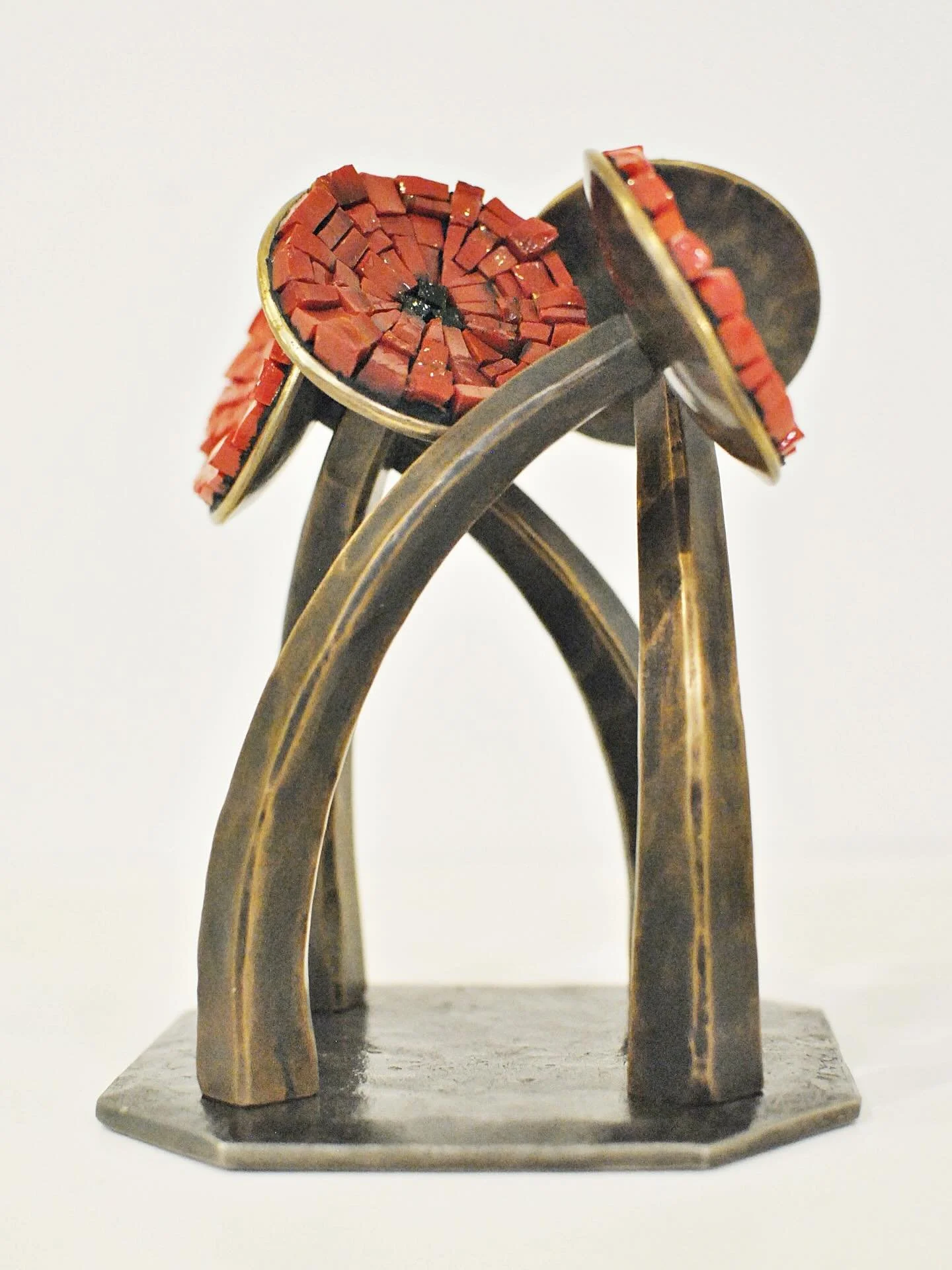 More rich red and gold with our short and swirly &ldquo;Poppies II&rdquo; in forged bronze and Italian smalti mosaic. This one stands approximately 7&rdquo; tall with a 5&rdquo; base. &diams;️✨ Find it in our Etsy shop. 
https://phoenixhandcraft.etsy