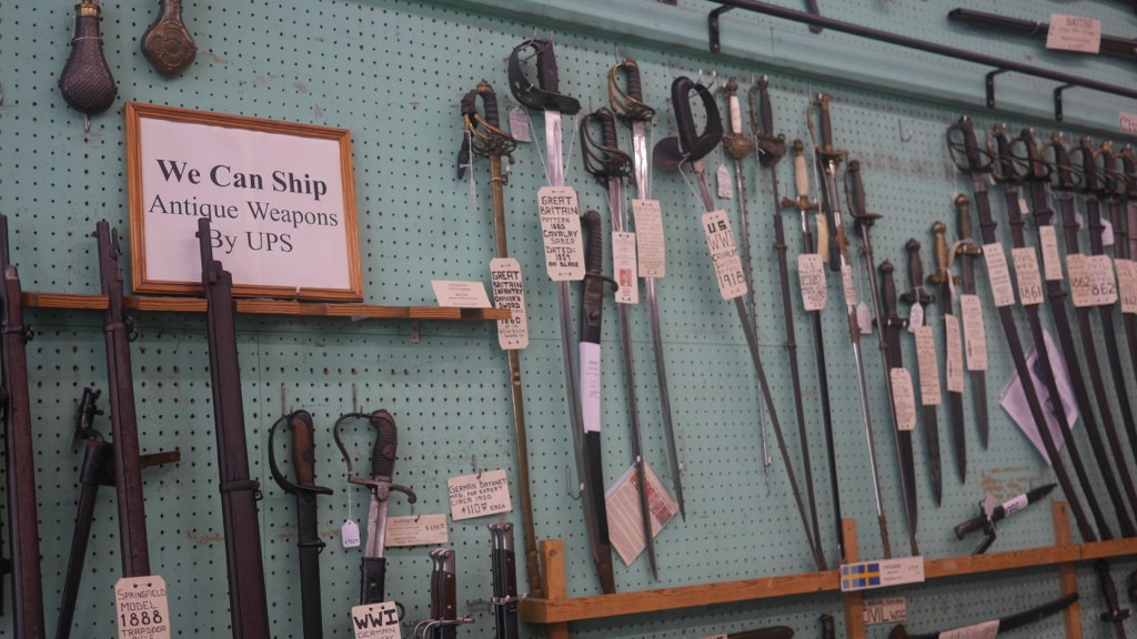 We went to a cool antique weapons and coins shop in the French Quarter. They had SWORDS!