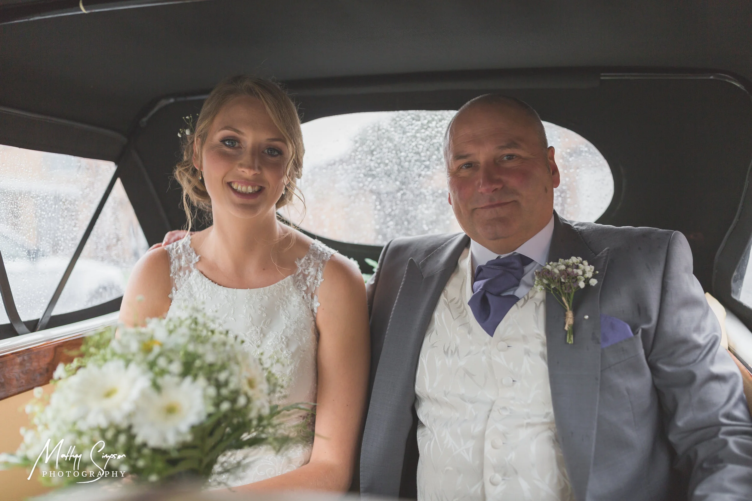 Bride and Father of Bride in Wedding Car